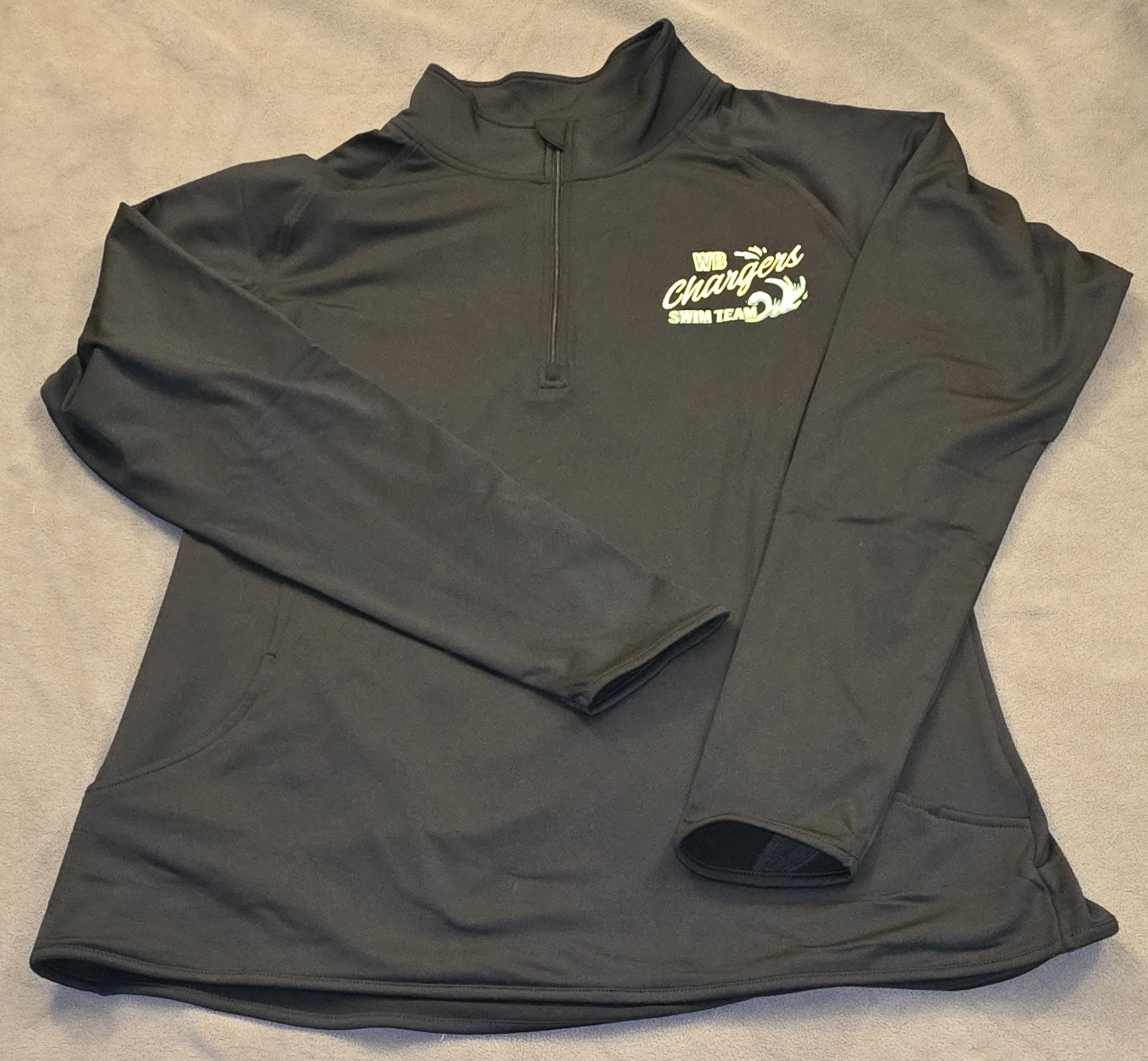 Black athletic quarter-zip pullover with an embroidered logo reading "WB Chargers Swim Team" on the left chest.