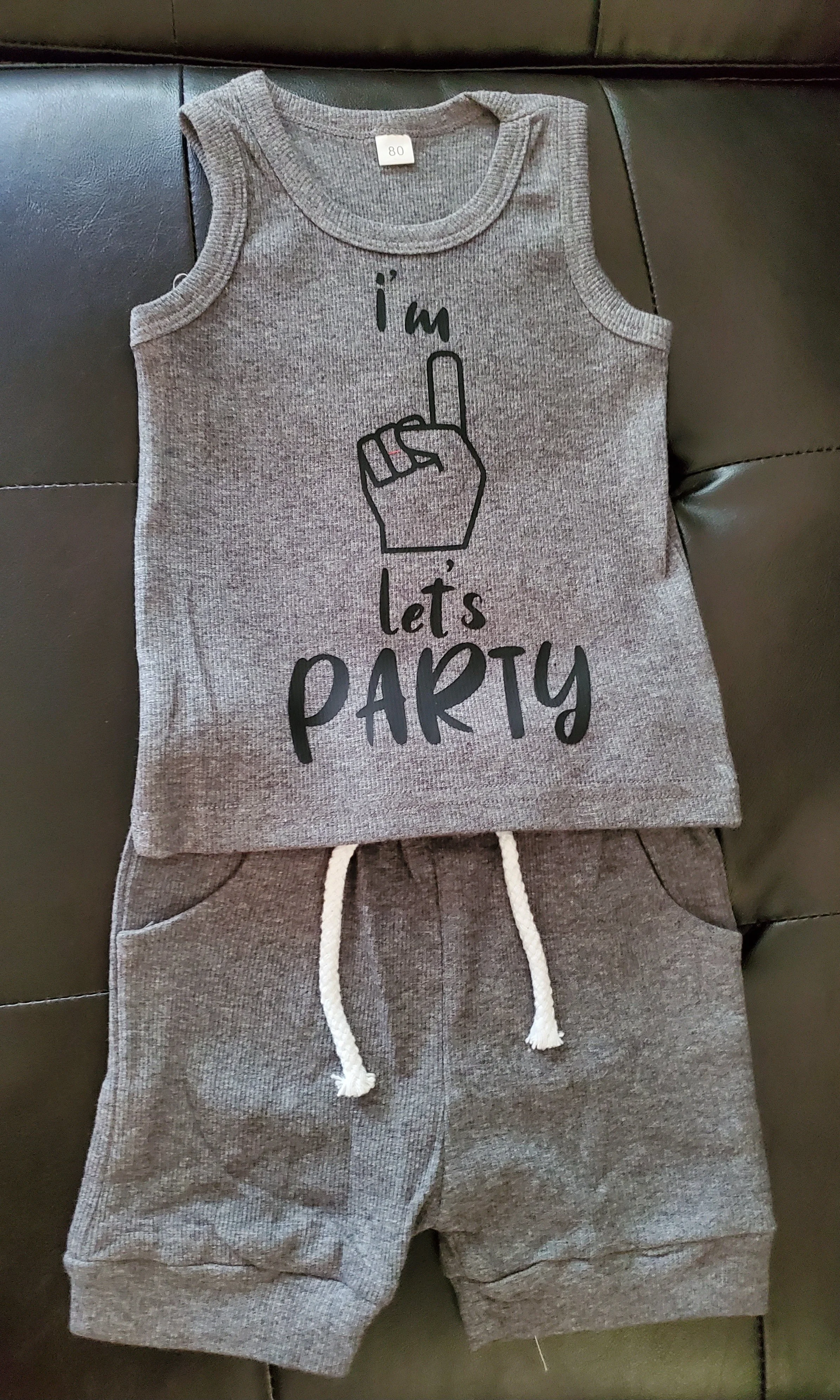 Gray sleeveless shirt with a print of a hand giving the middle finger and the text 'I'm Let's Party'.