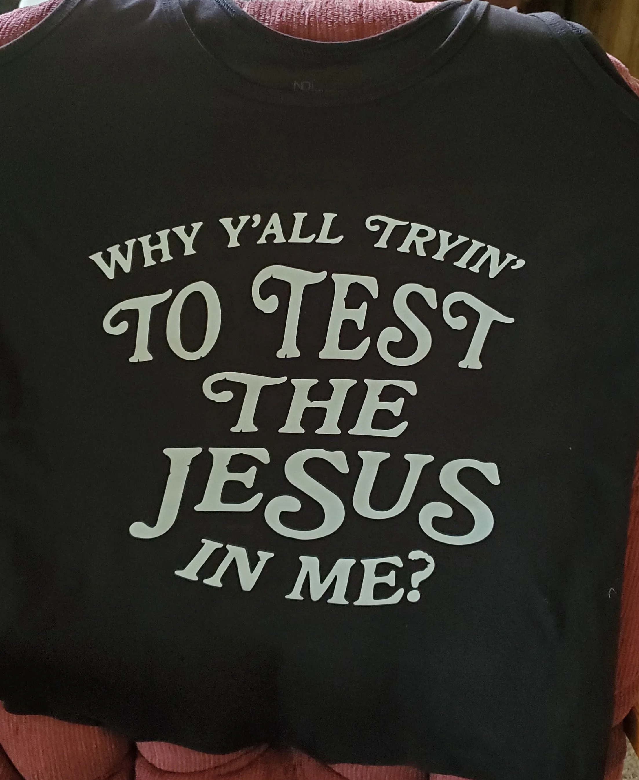 Black T-shirt with white text that reads, 'Why y'all tryin' to test the Jesus in me?'