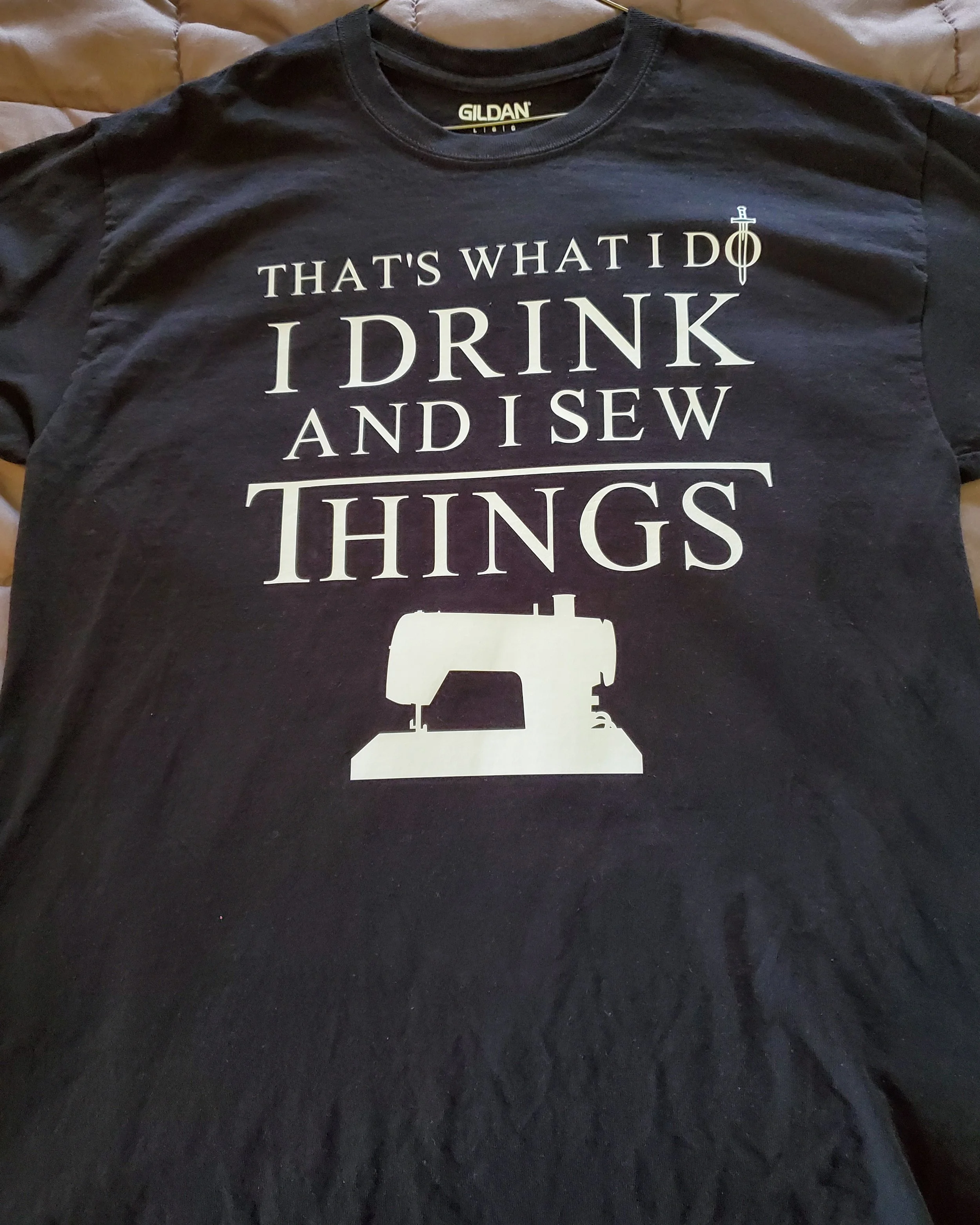 Black T-shirt with white text that reads 'That's what I do I drink and I sew things' and a sewing machine graphic.
