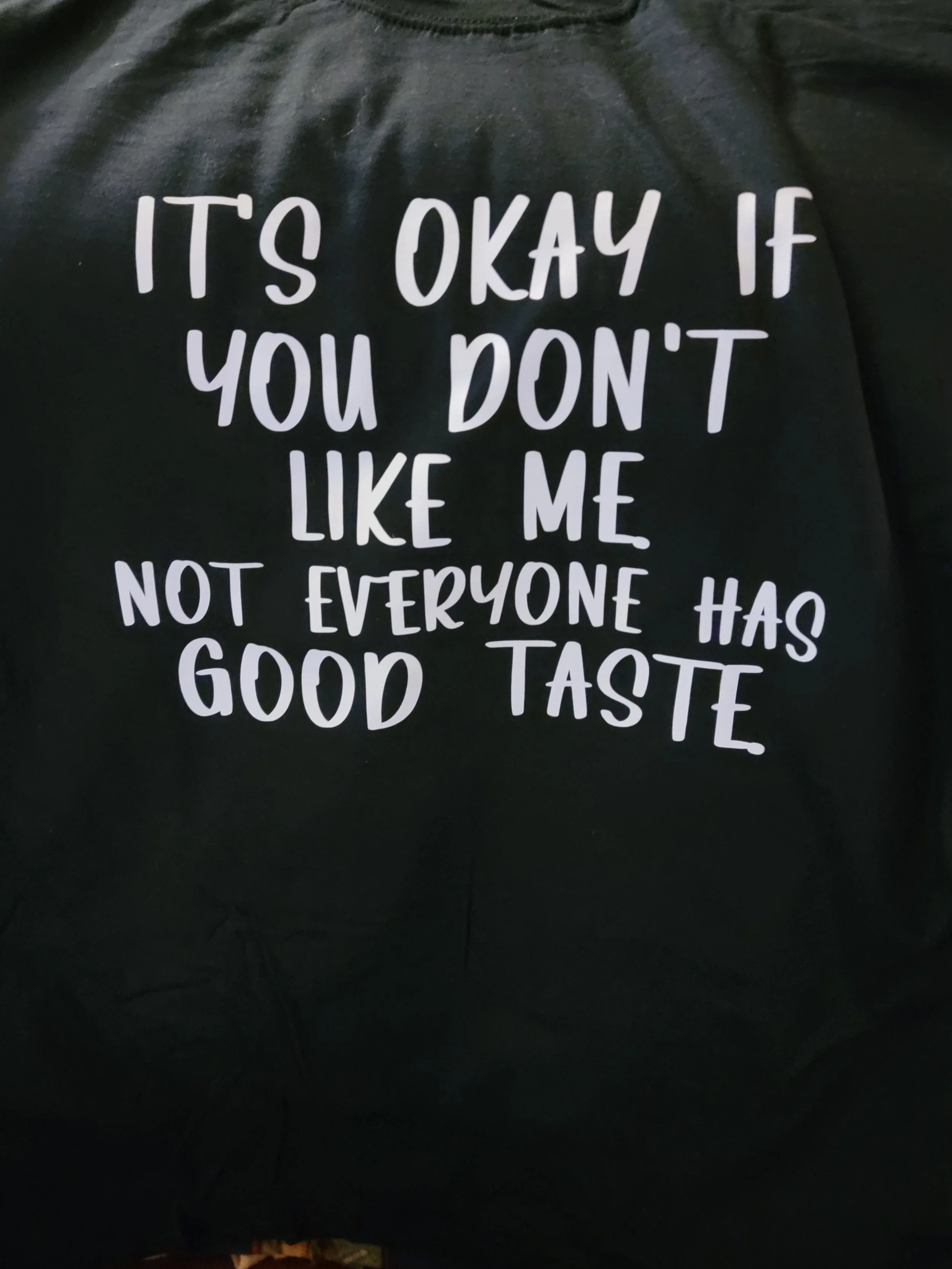 Black background with white text that reads 'It's okay if you don't like me. Not everyone has good taste'.