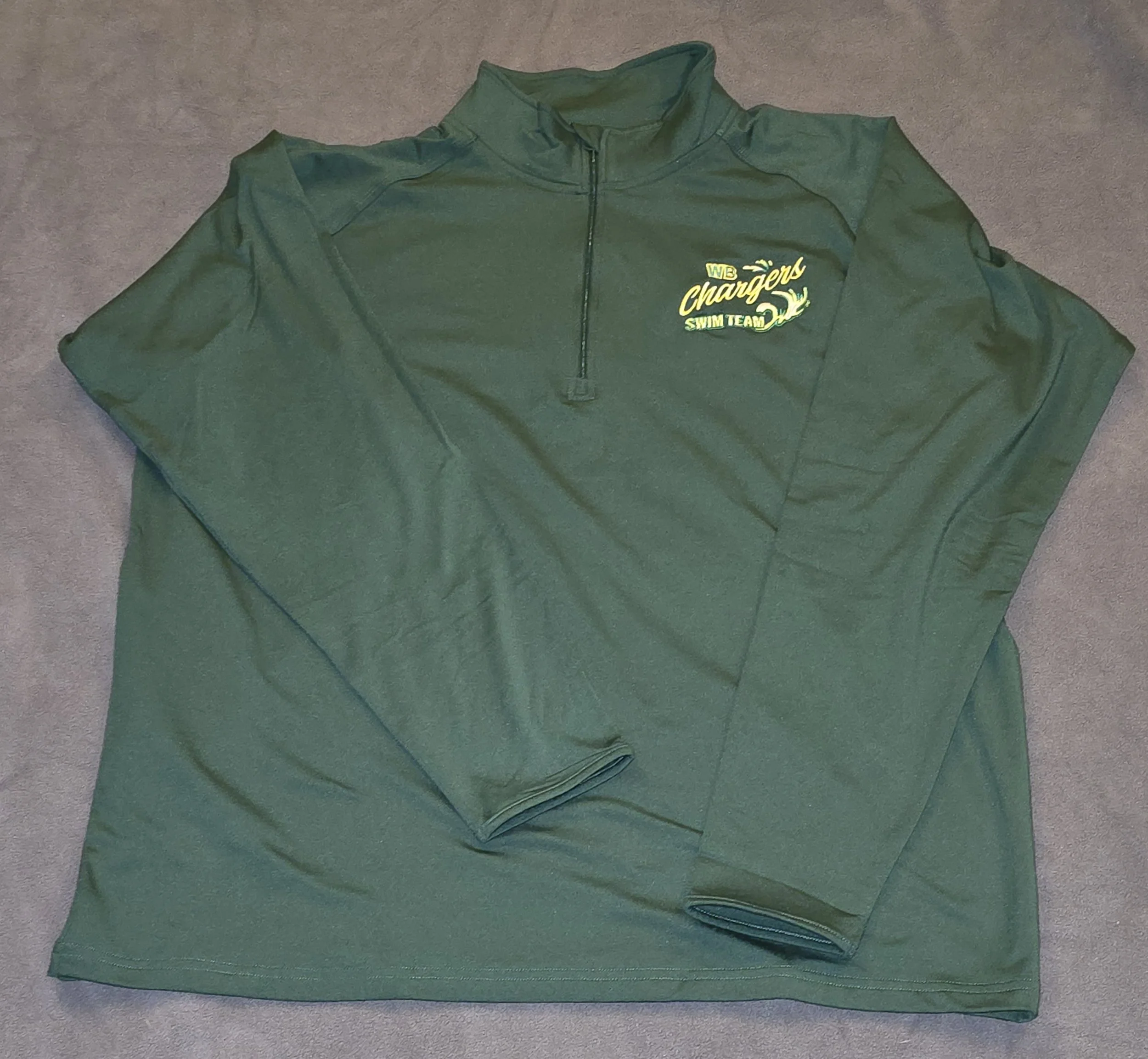 Green long-sleeve quarter-zip sports top with 'WD Chargers Swim Team' logo on the chest.