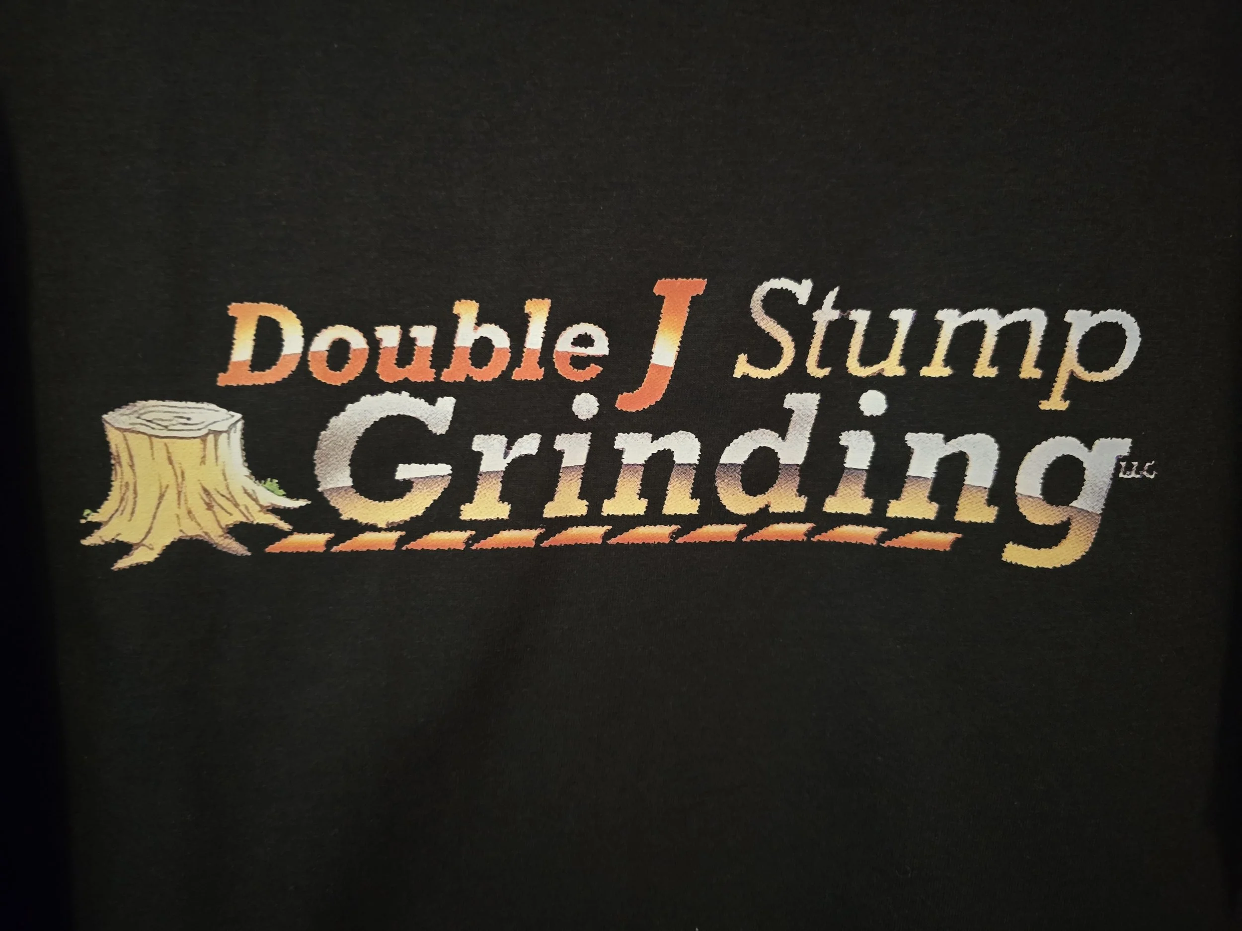 Logo of Double J Stump Grinding LLC with a tree stump illustration.