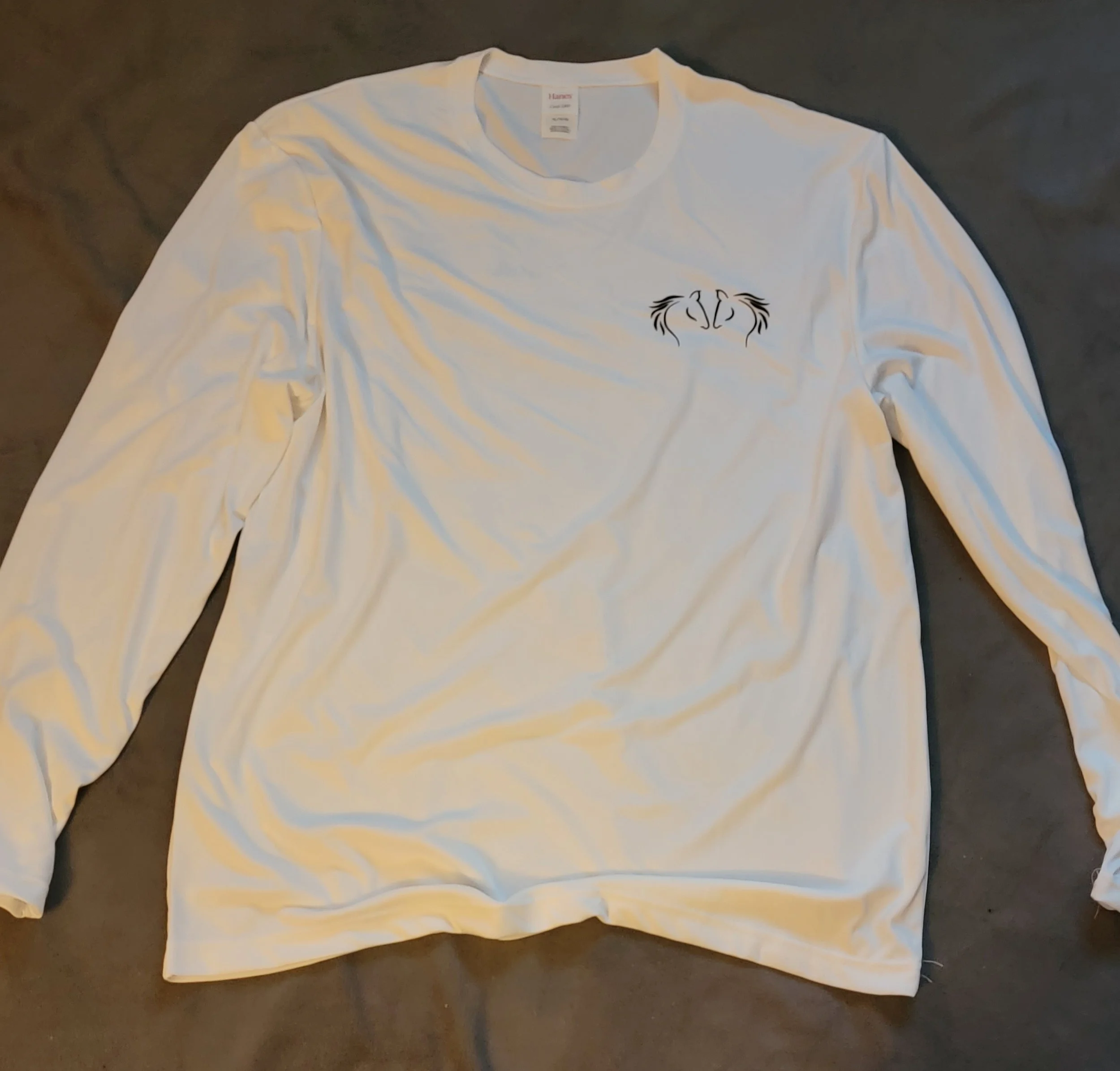 White long-sleeve shirt with a small black design of two stylized animals facing each other near the chest area.