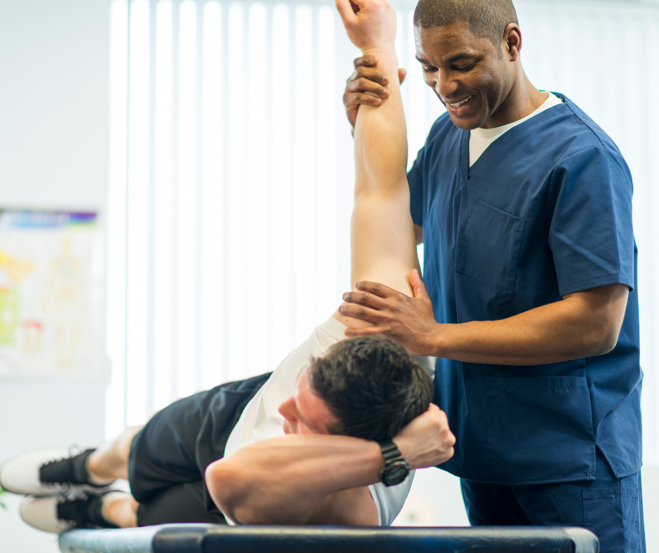 Physical therapist guiding a patient through a rehabilitation exercise