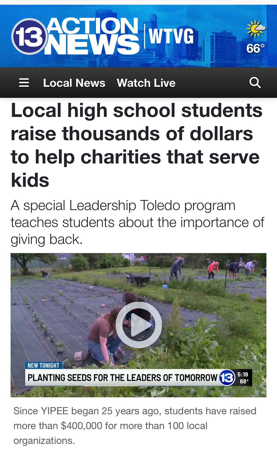 Students pose together for a group photo, smiling and facing the camera