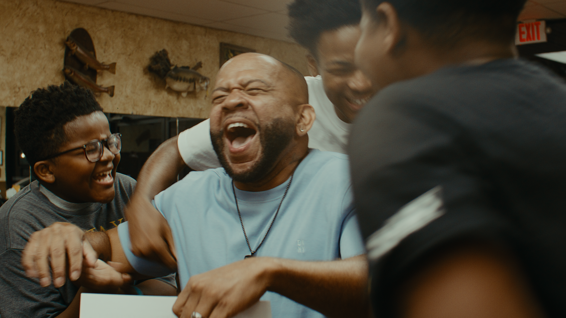Group of friends laughing together in a restaurant