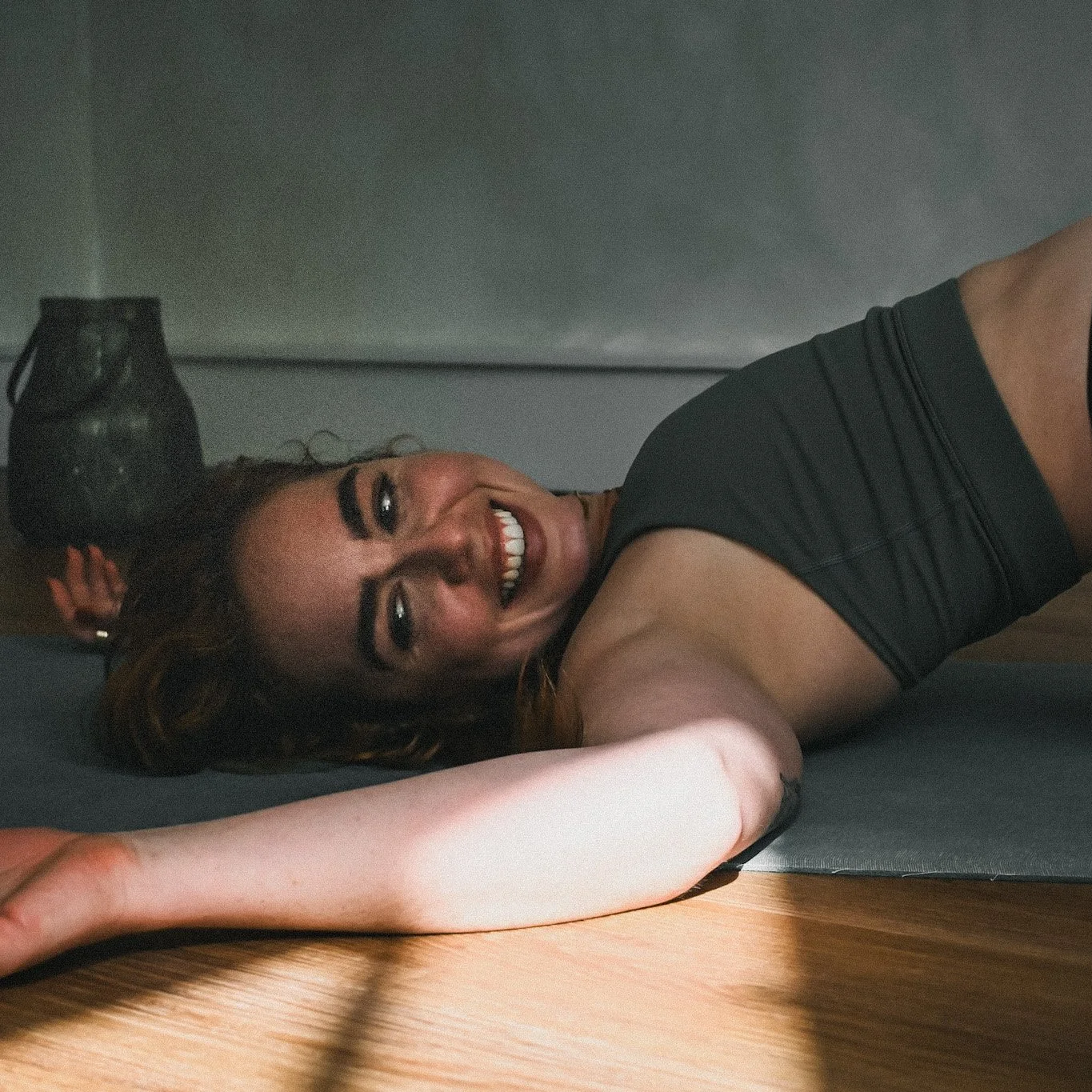 Smiling female in gentle backbend
