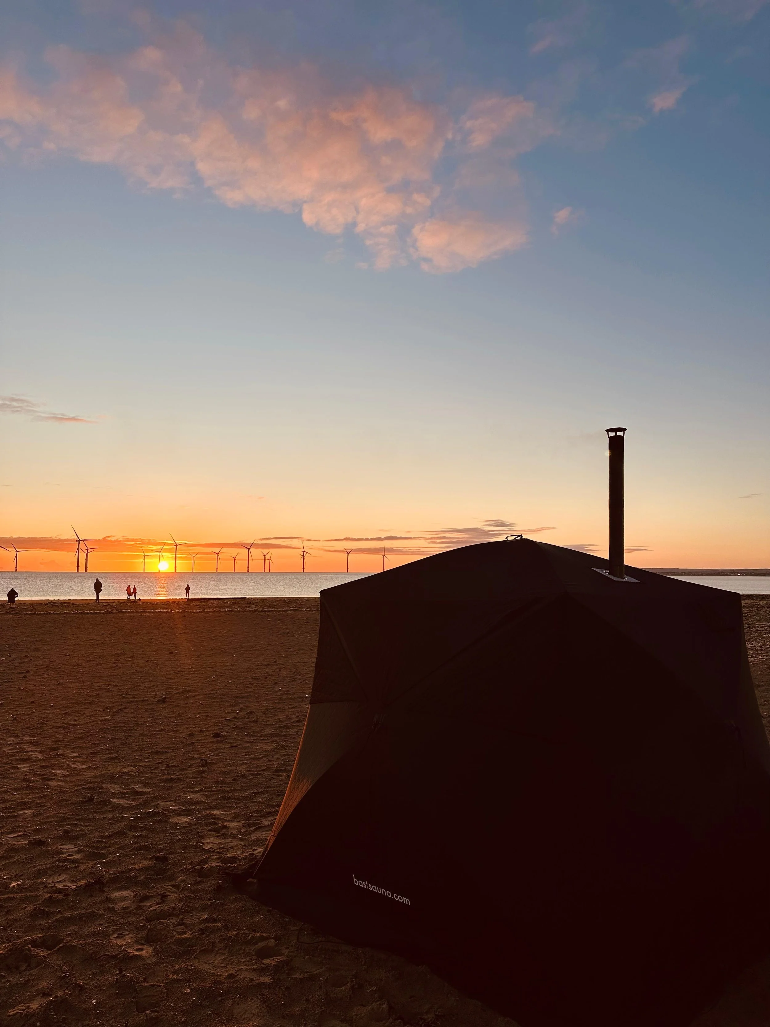 image of pop up tent sauna at sunset on south gare beach redcar