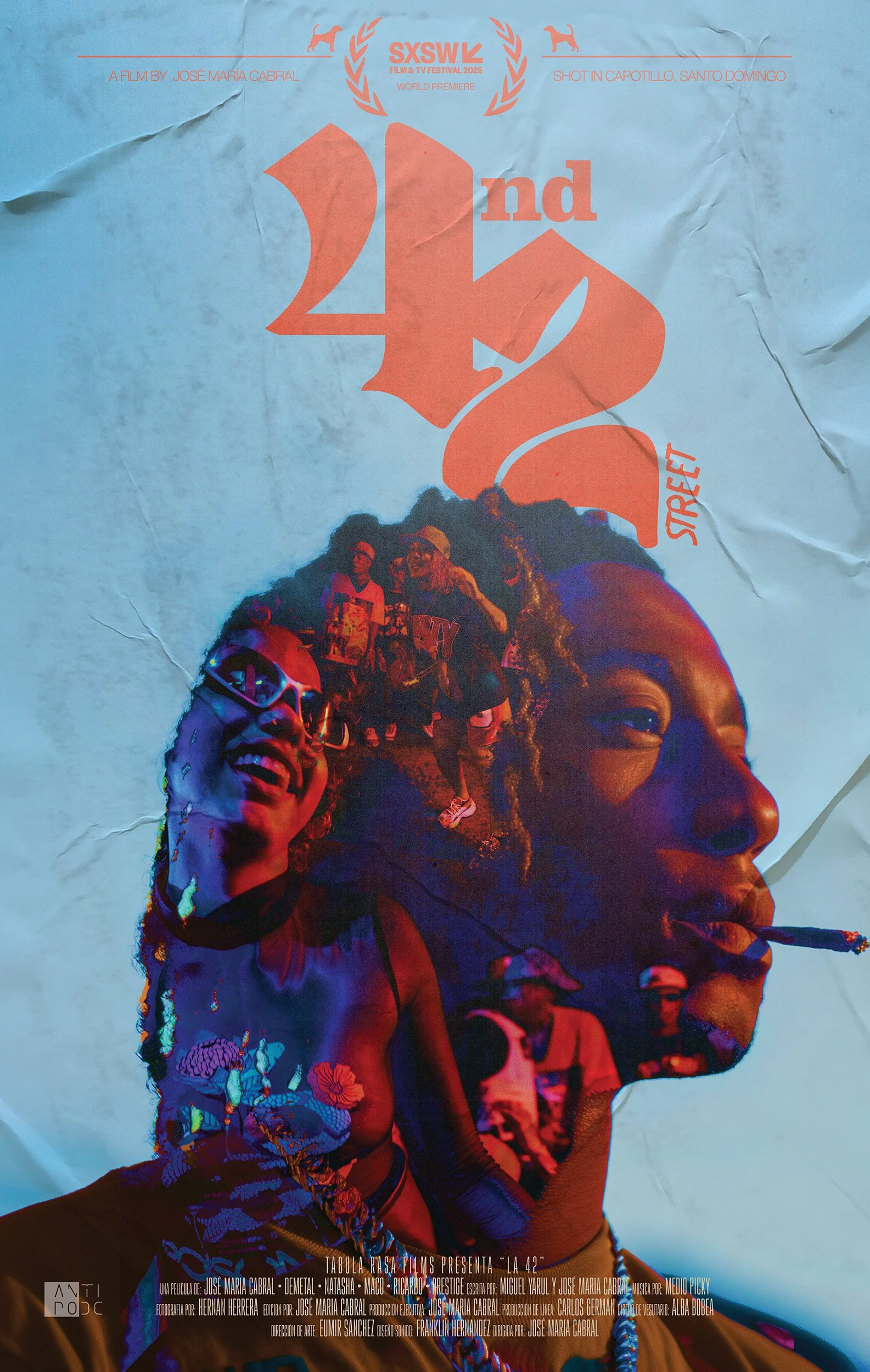 Movie poster for 'Village Keeper' showing two women embracing against a cloudy sky. One woman has gray hair and wearing patterned clothing, and the other has curly hair with a headband, appearing emotional.