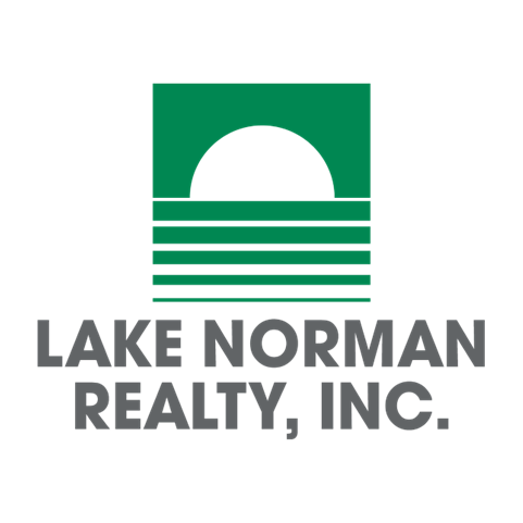 Logo of Lake Norman Realty, Inc. featuring a stylized green arch over horizontal lines and black text.