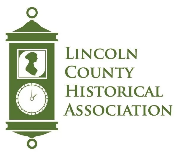 Logo of Lincoln County Historical Association featuring a clock and silhouette.