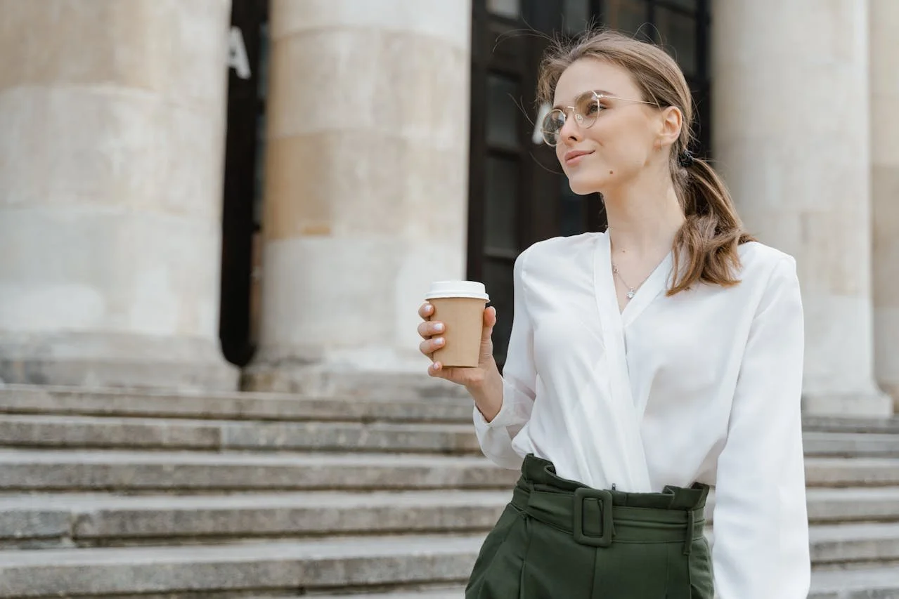 woman-in-white-dress-shirt-holding-white-coffee-mug