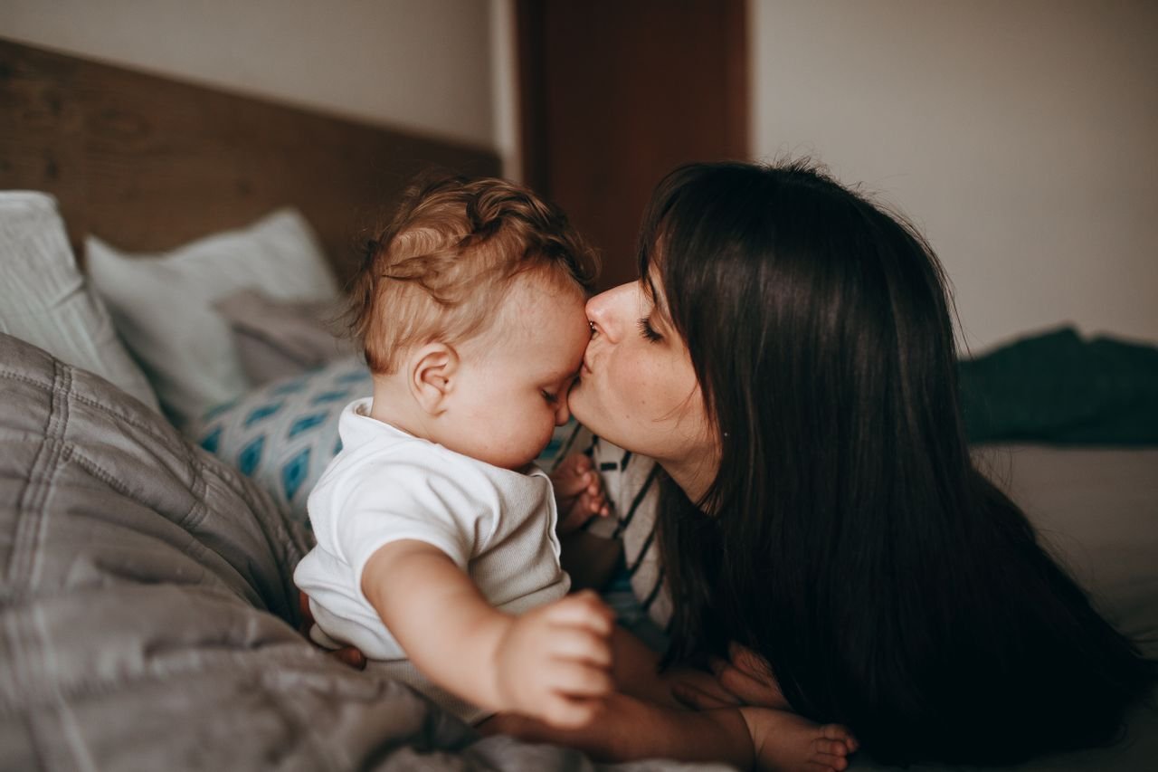 mother-kissing-baby