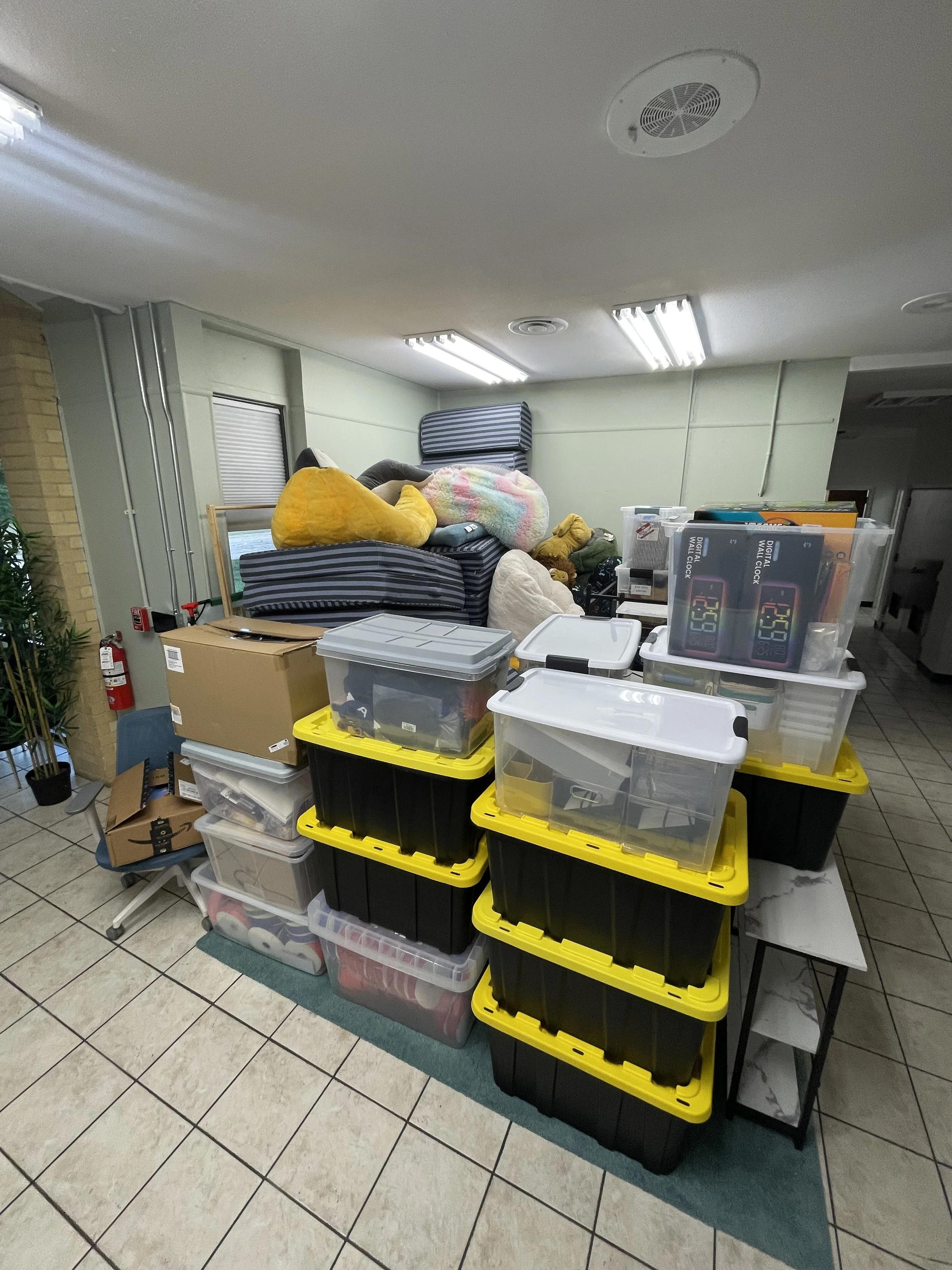 small cheap movers pickup truck moving fully packed boxes in office room austin texas moving company