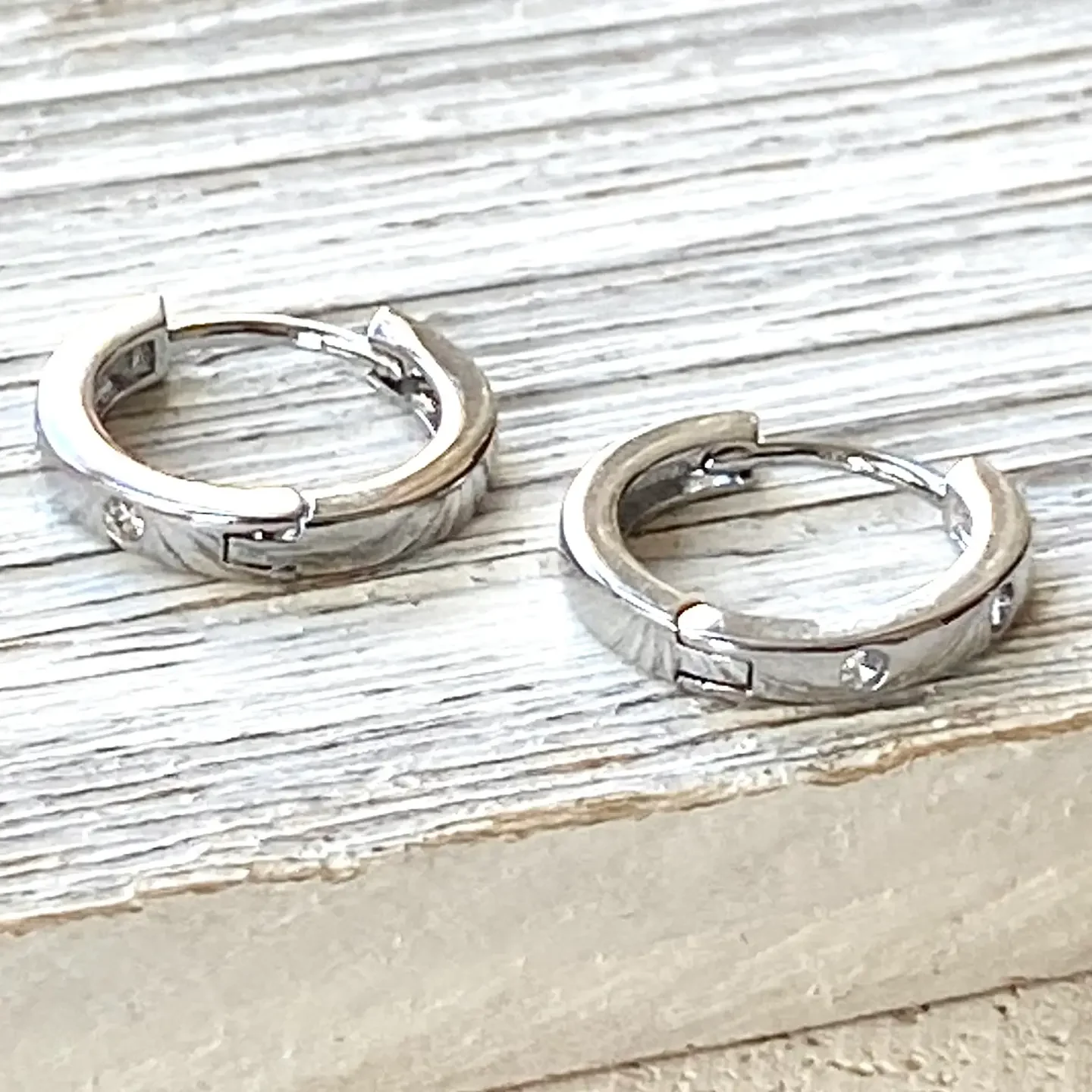 silver huggy hoops.webp