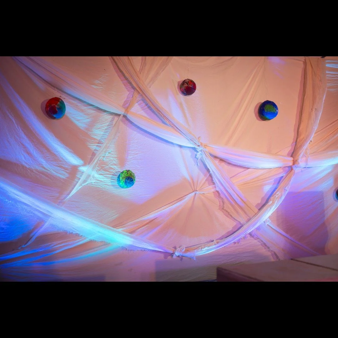 🌎We LOVE the globes featured on the backdrop of the set for "Lungs!"🌏

The Justice Theater Project's Production Manager Bruklyn Miller helped local children make these globes which depict what they want the world to look like when they gr