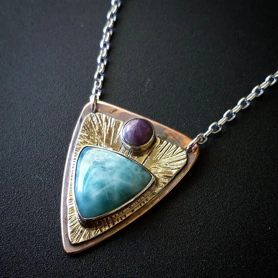 New larimar and charoite &quot;shield pendant&quot; just went to @artworksgallerygrassvalley . That copper background brings out the rich color of the stones. DM if you are interested and can't make it into the gallery

#pkleinjewelry #larimar #larim