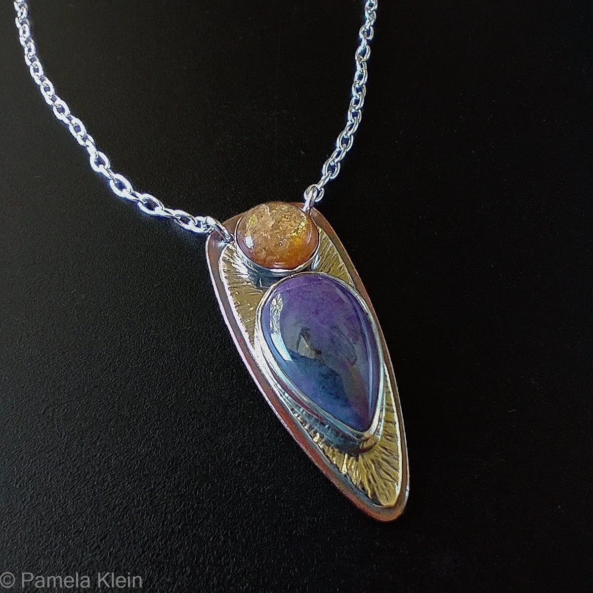 I'm on a sugilite kick! These are the first three of a few I'll be working on over the next couple weeks. I love purple and orange. Next up: purple and green! I have some gaspeite and prehnite waiting to hang out with more sugilite. Somehow the richn