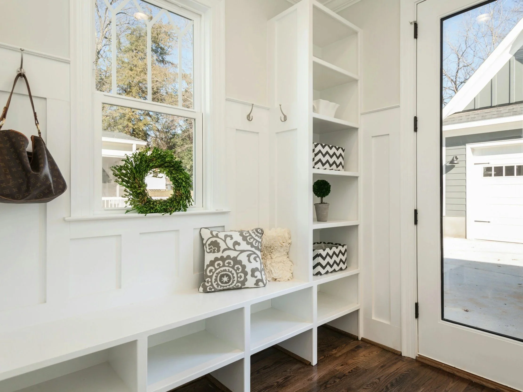 Organized mudroom with bins for a busy household