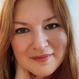 Natalia smiling at the camera