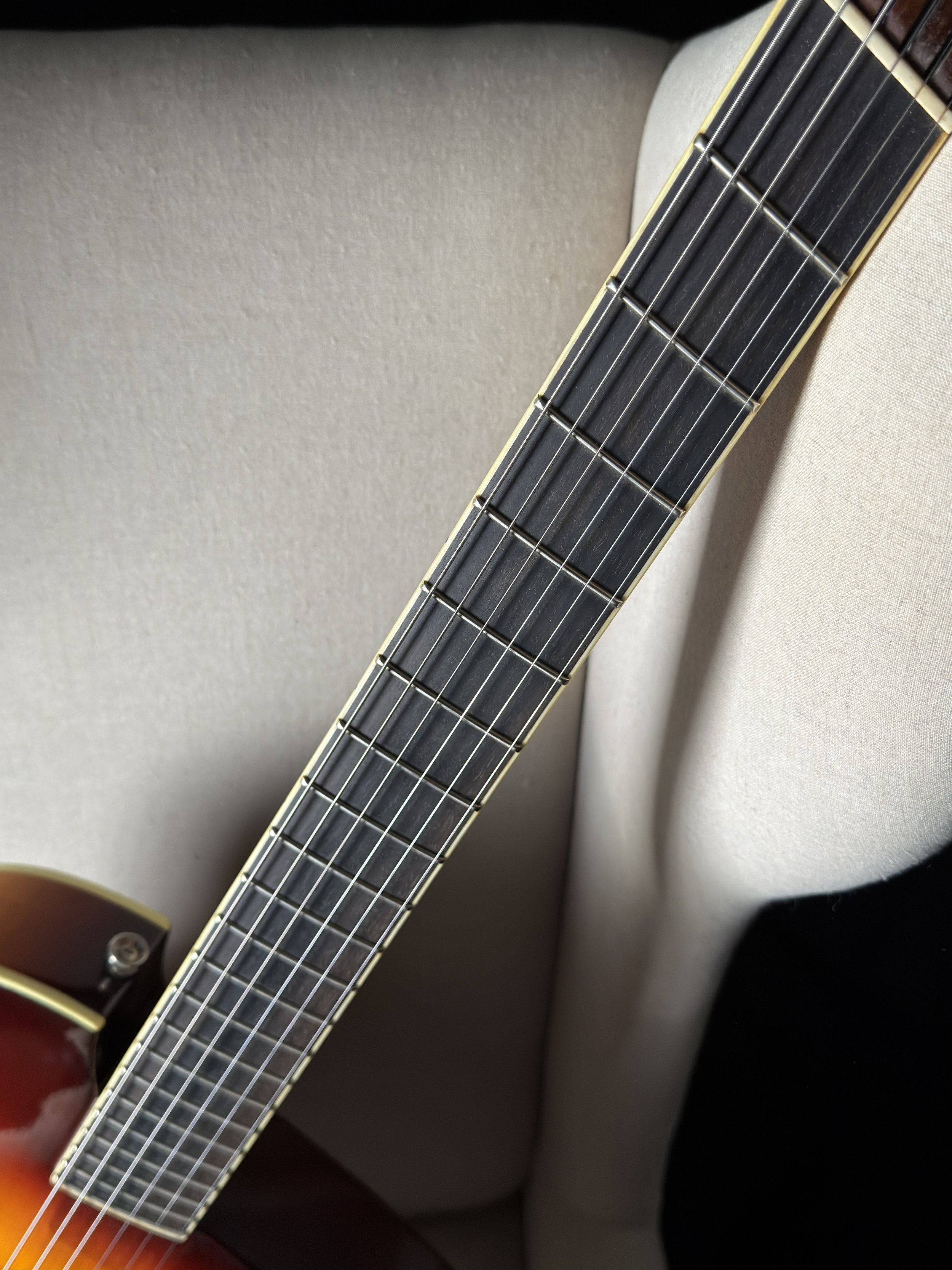 Koll RE Archtop showing multiscale fretboard