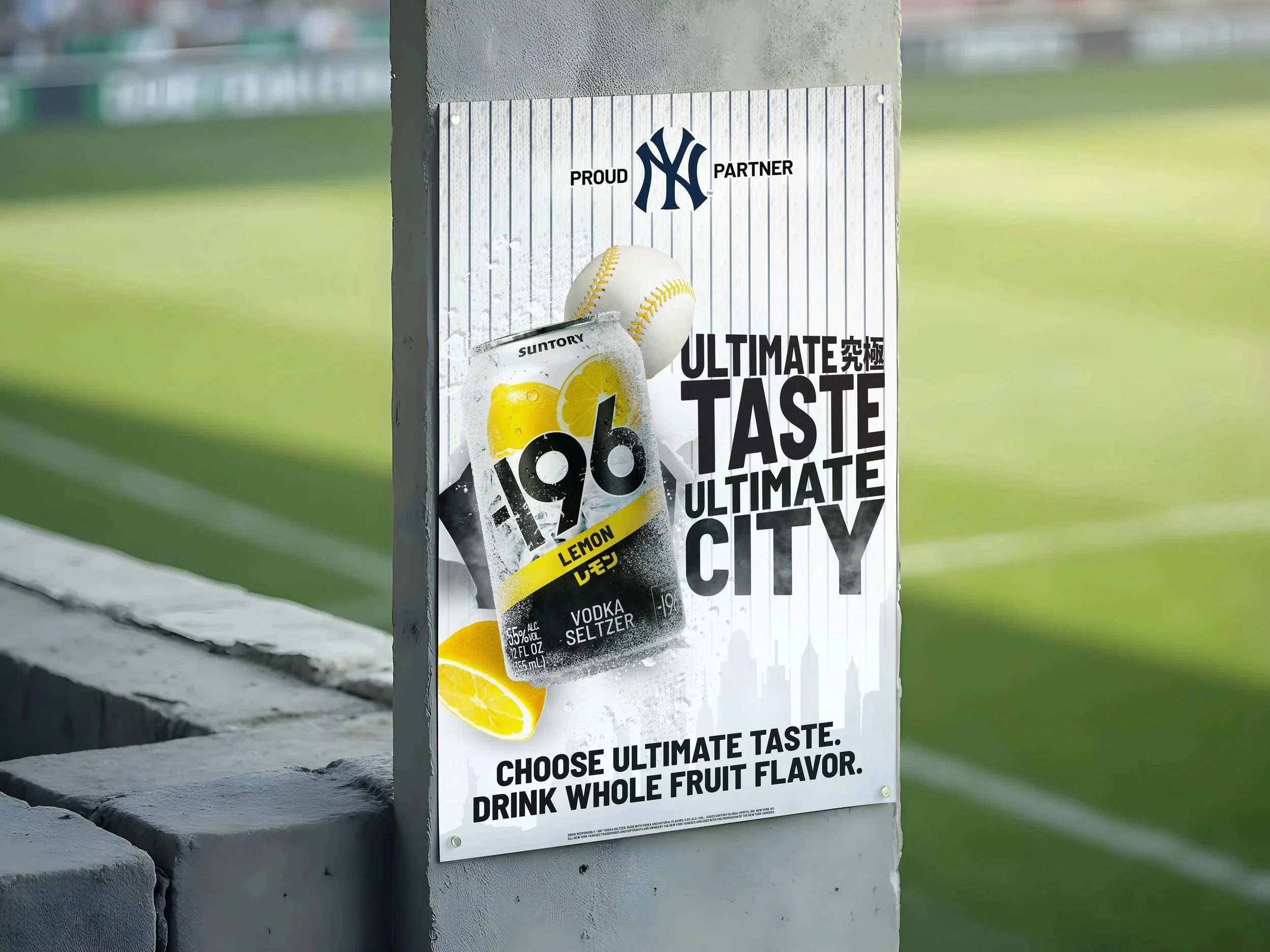 A poster advertising Suntory A99 Lemon Vodka Seltzer with a New York Yankees logo and slogan on a pole near a sports field.