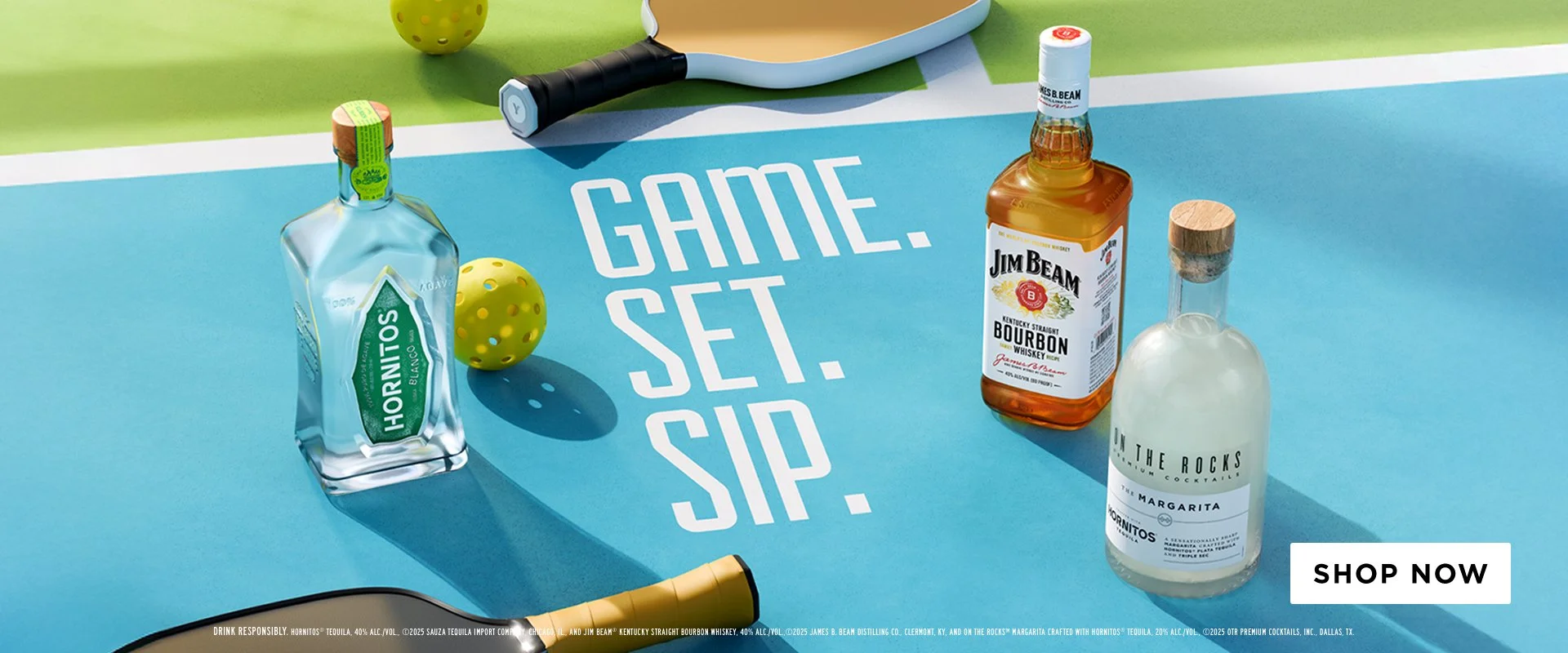 A colorful table tennis-themed setup featuring bottles of Hornitos tequila, Jim Beam bourbon whiskey, and The Rocks margarita, alongside a table tennis paddle, ball, and a yellow cone, with a message reading "GAME. SET. SIP." and a "SHOP NOW" button.