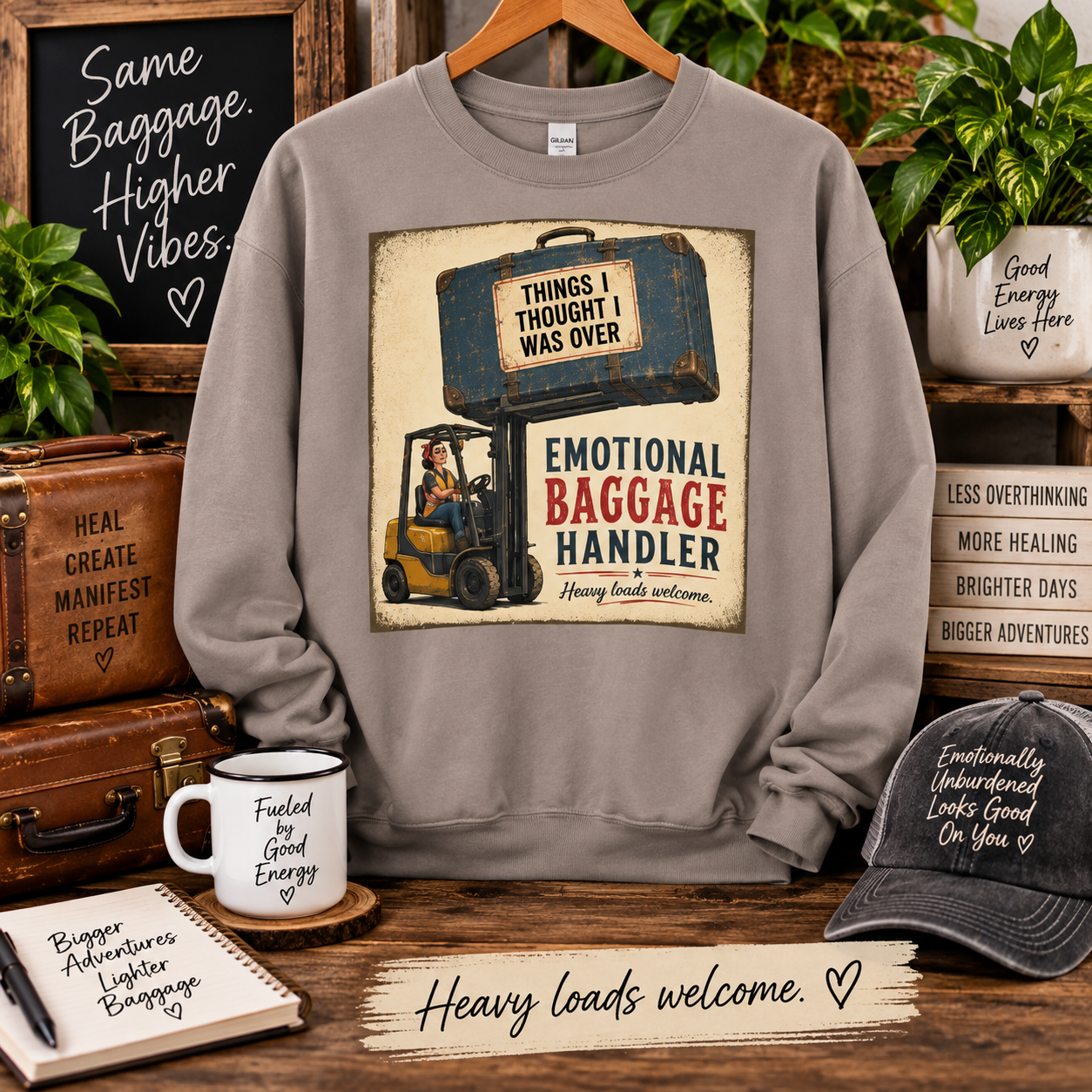 Emotional Baggage Handler sweatshirt featuring a retro forklift carrying “Things I Thought I Was Over,” a funny design for energy healers and Emotion Code practitioners.