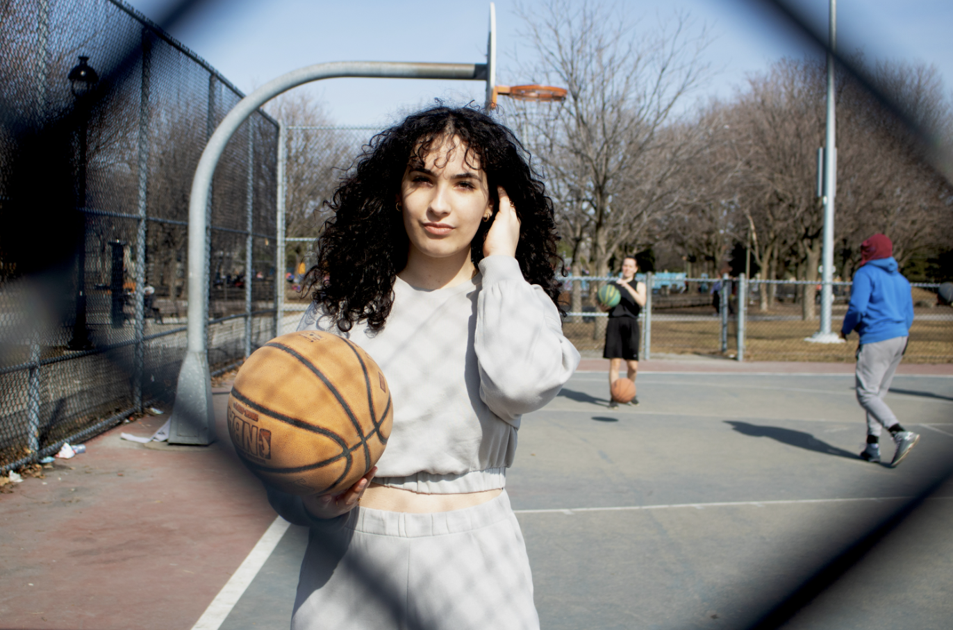 Lamia Dib, 23, plays basketball at Jarry Park in Montreal.