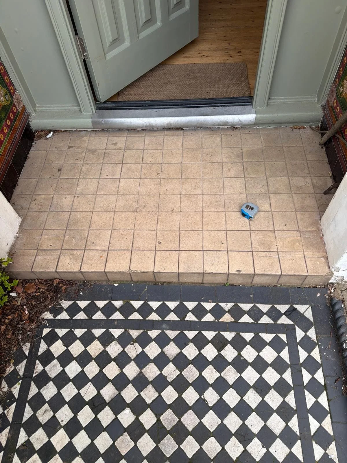 Before and after, our client was adamant on using reclaimed tiles so we installed them along with a new yorkstone threshold. We also undertook a large restoration project of the existing front path.