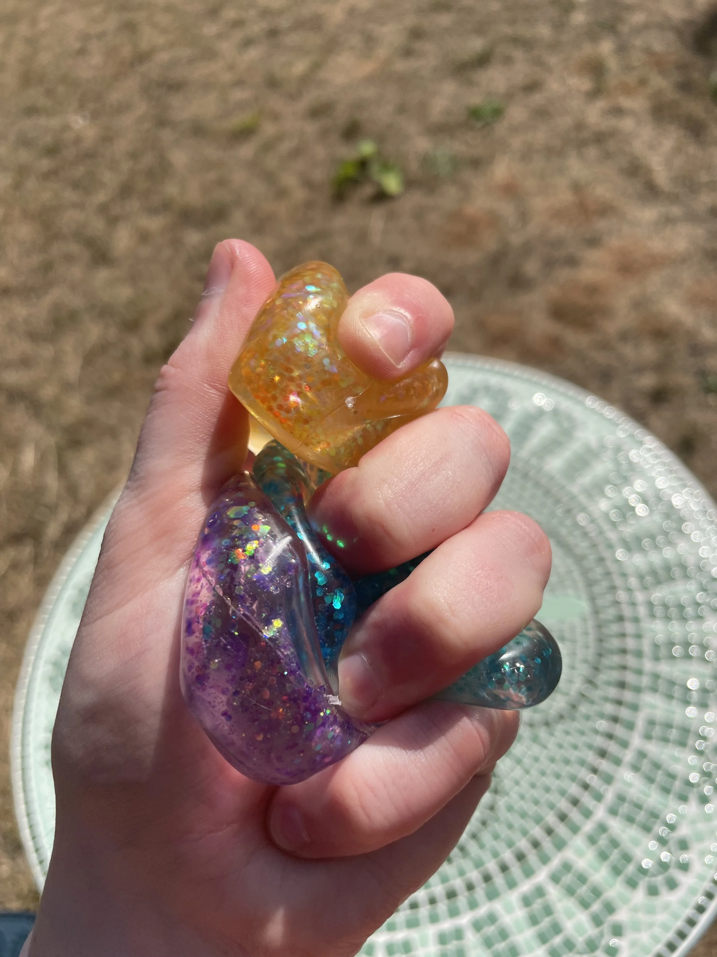 Glitter Squish Cubes Held Squished.jpg