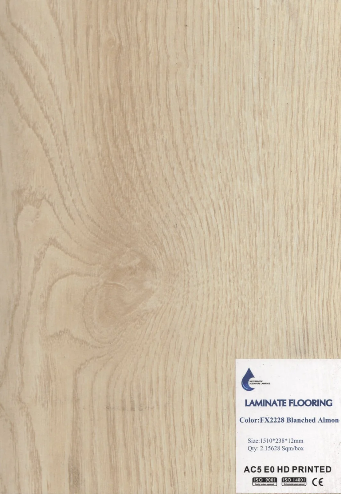 Sample of laminate flooring with light wood grain pattern and a label indicating color, size, and specifications.