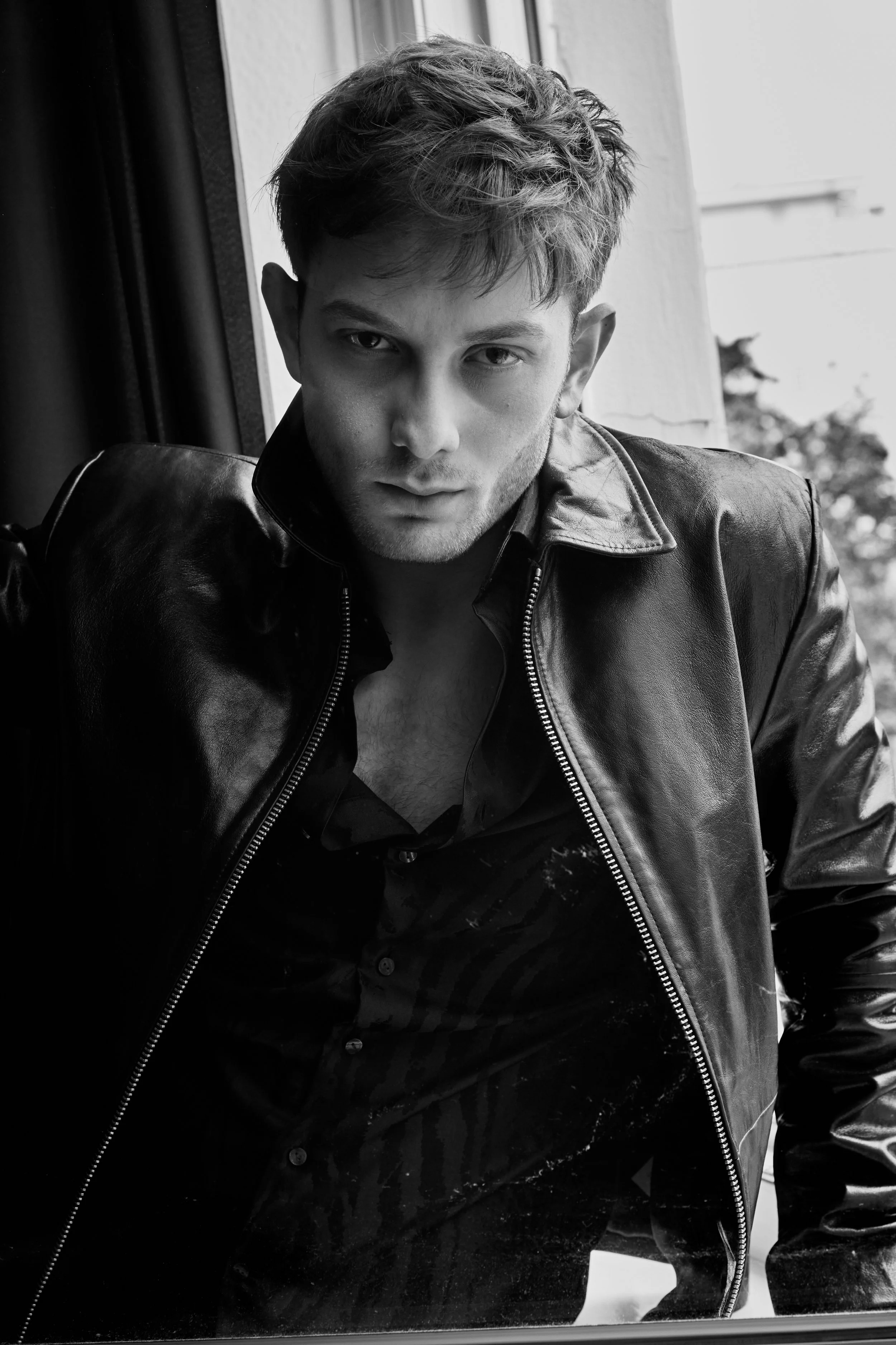 Antonio Chobanov Photographed by Miro Chobanov in Black and White. Antonio is wearing Tom Ford Leather jacket and a Roberto Cavalli shirt.