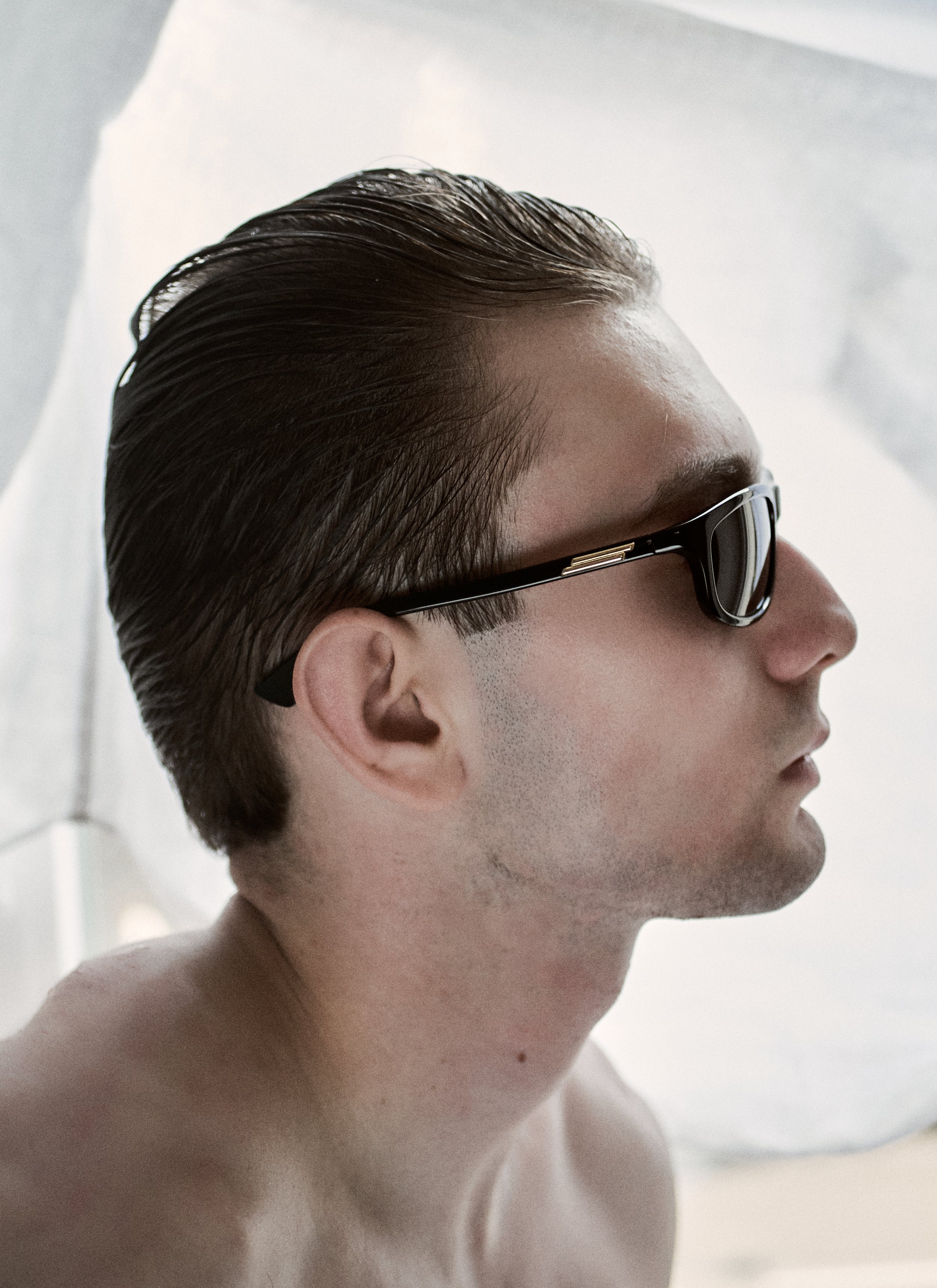 Antonio, wearing Bottega Veneta sunglasses and Cartier Jewelry. Photography by Miro Chobanov