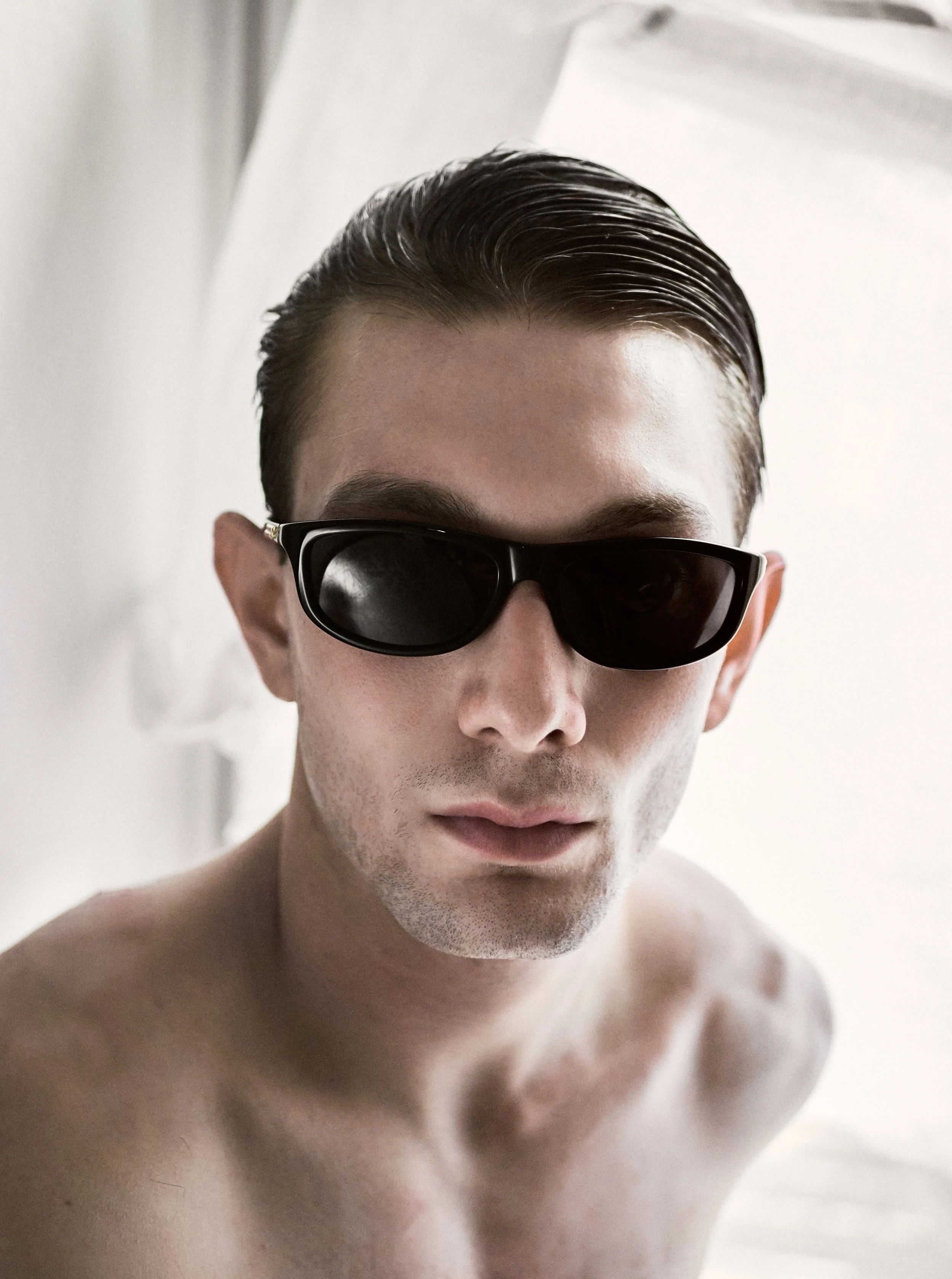 Antonio, wearing Bottega Veneta sunglasses and Cartier Jewelry. Photography by Miro Chobanov