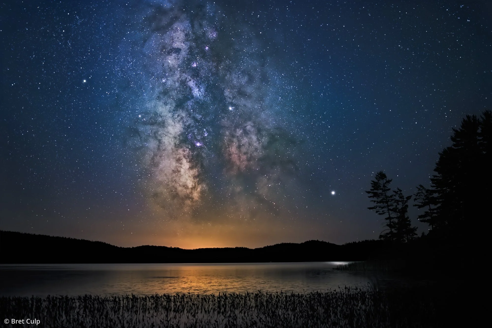 Milky Way, Jupiter and Saturn over Grand Lake at Achray Campground in Algonquin Park, Ontario, by Bret Culp