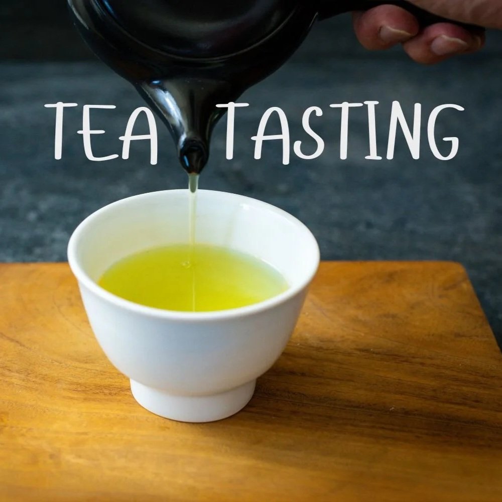 Closeup of a hand pouring green tea from a pot into a cup with the text "tea tasting" overlayed across the center.