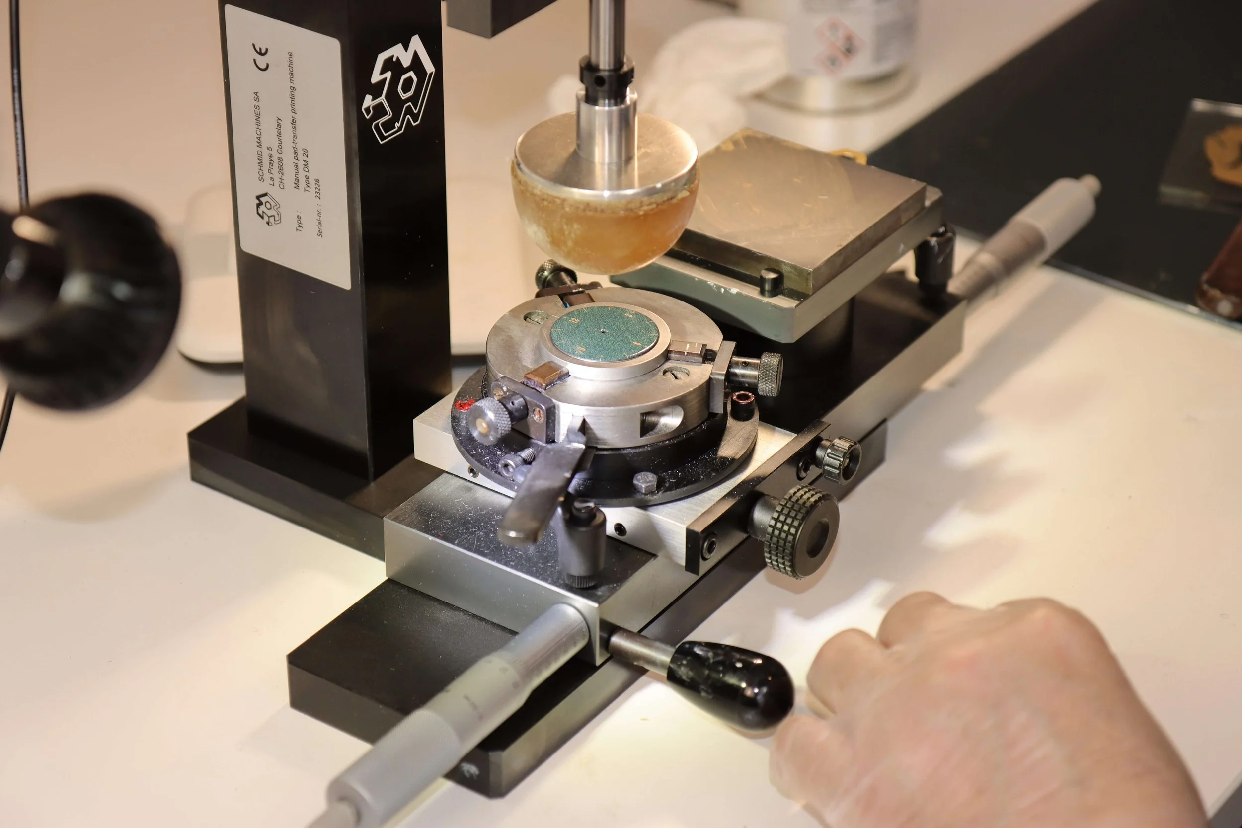 Mike Moriarty printing a watch dial by hand machine
