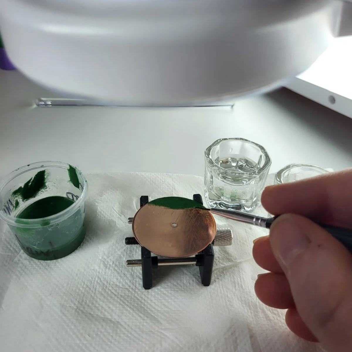 Alison Moriarty enameling a watch dial