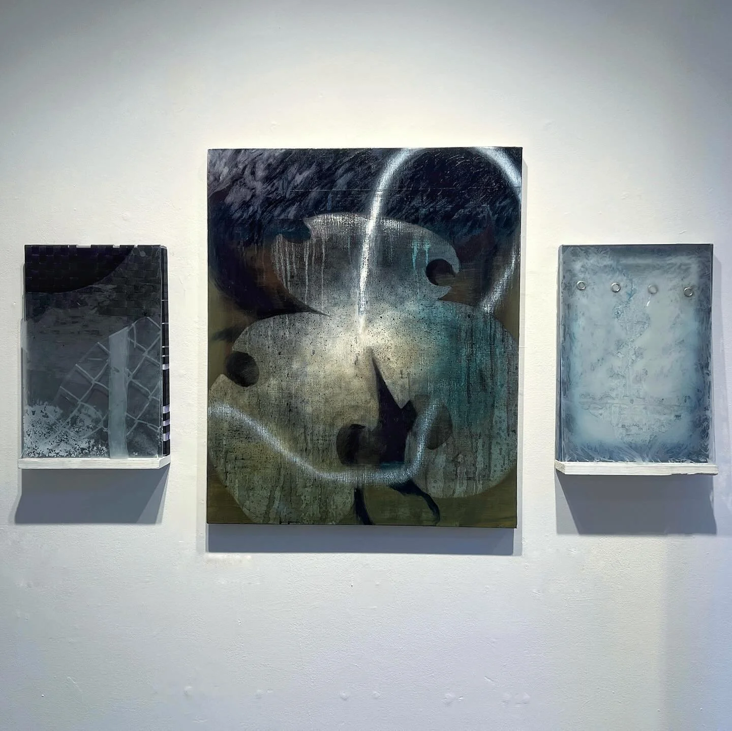 Triptych
etched glass, oil on canvas, woven strap, acrylic on shower curtain, grommets, sand 
35x50&rdquo;

Left to Right:

Meeting Point

storm through a flower pressed against a window 

Sword fight