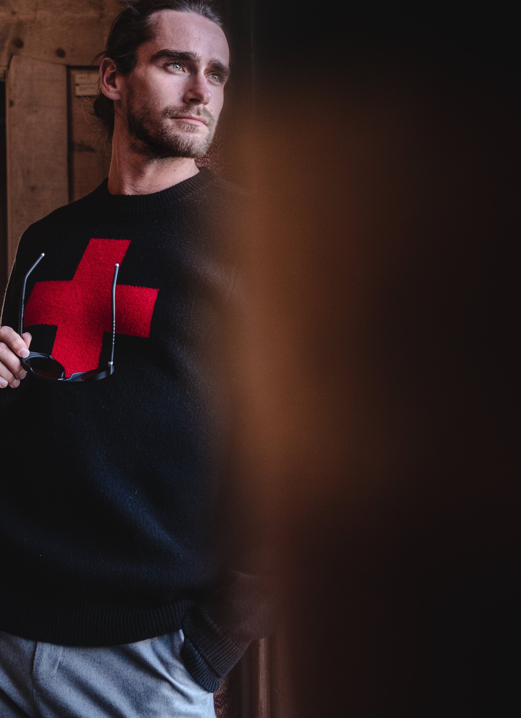 man looking out of doorway