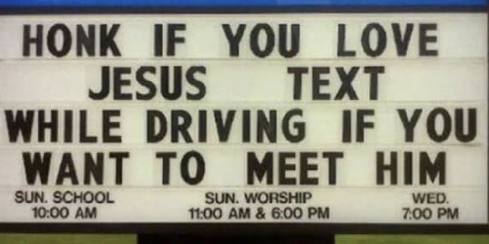 Church sign with the message: "HONK IF YOU LOVE JESUS. TEXT WHILE DRIVING IF YOU WANT TO MEET HIM." Schedule details at bottom include Sunday School at 10:00 AM, Sunday Worship at 11:00 AM and 6:00 PM, and Wednesday service at 7:00 PM.