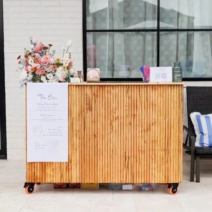 The Tumbleweed modern mobile bar rental with fluted design and warm wood by Sipsy Schooner Oklahoma