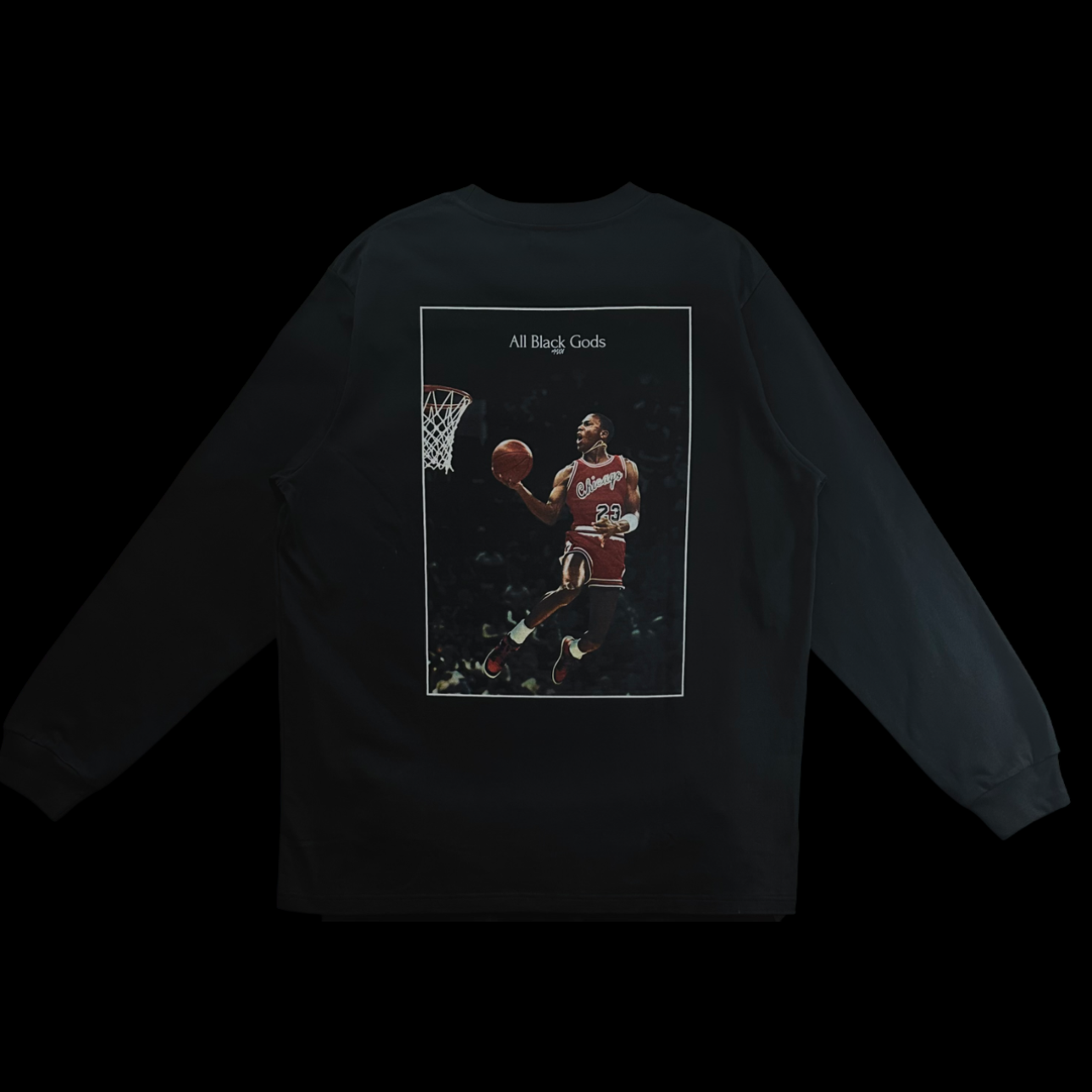 Black long-sleeve shirt with a photo of basketball player Michael Jordan in mid-air, holding a basketball, wearing a red Chicago Bulls jersey, and a text overlay reading 'All Black Gods' at the top.
