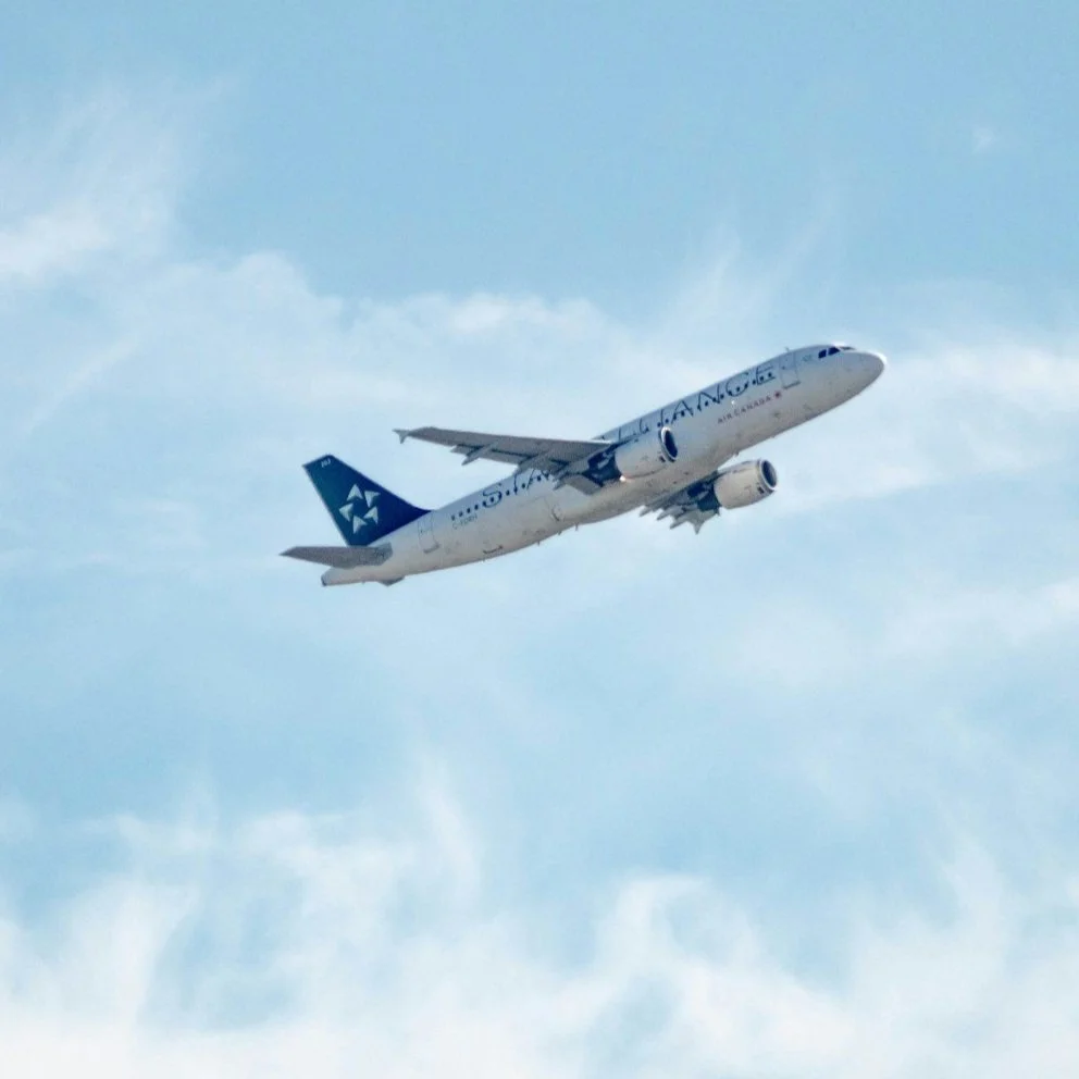 Commercial airplane in flight against blue sky
