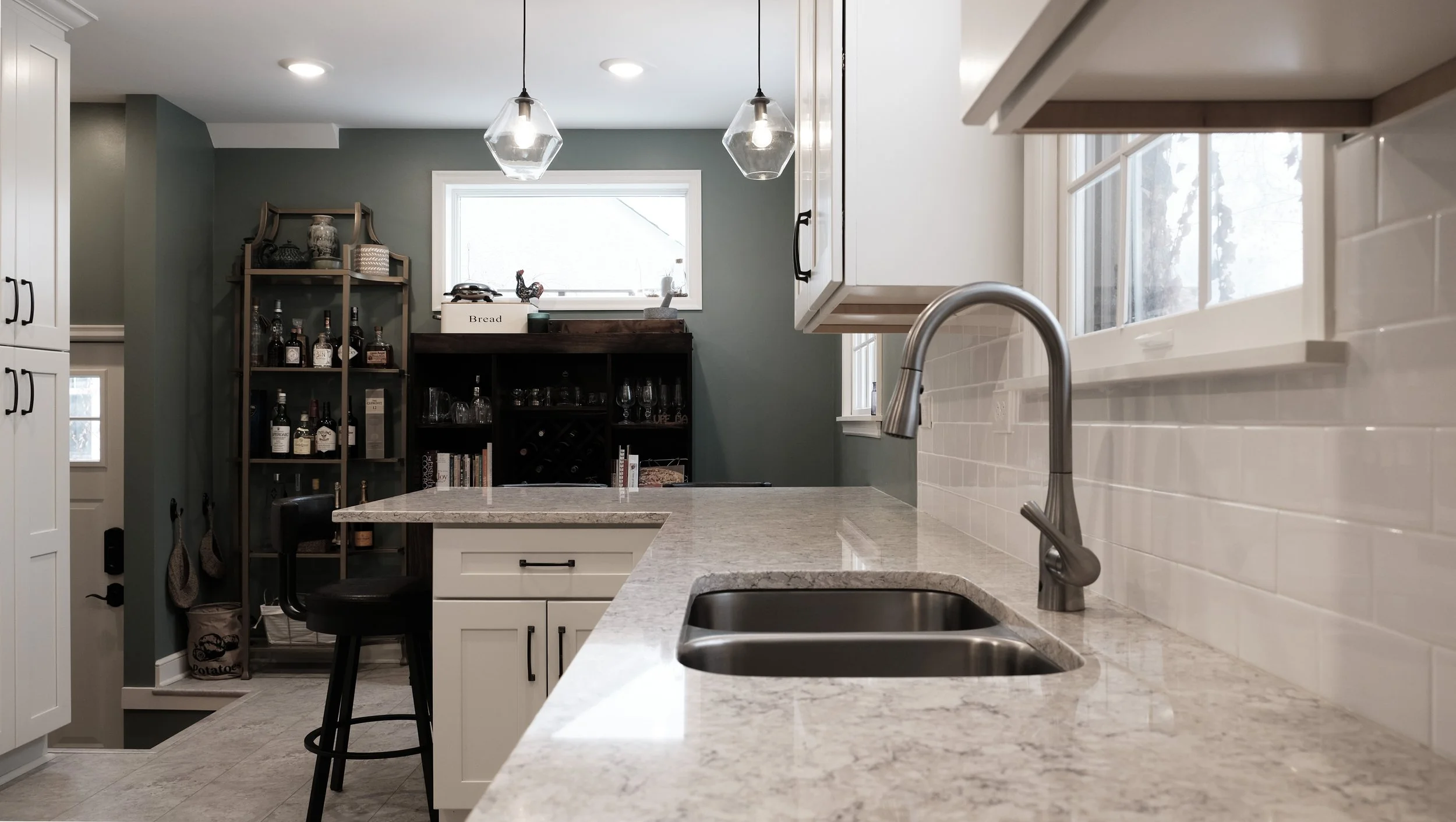  Sink and peninsula, looking towards the side wall, with a high window to allow plenty of south light while having privacy.  