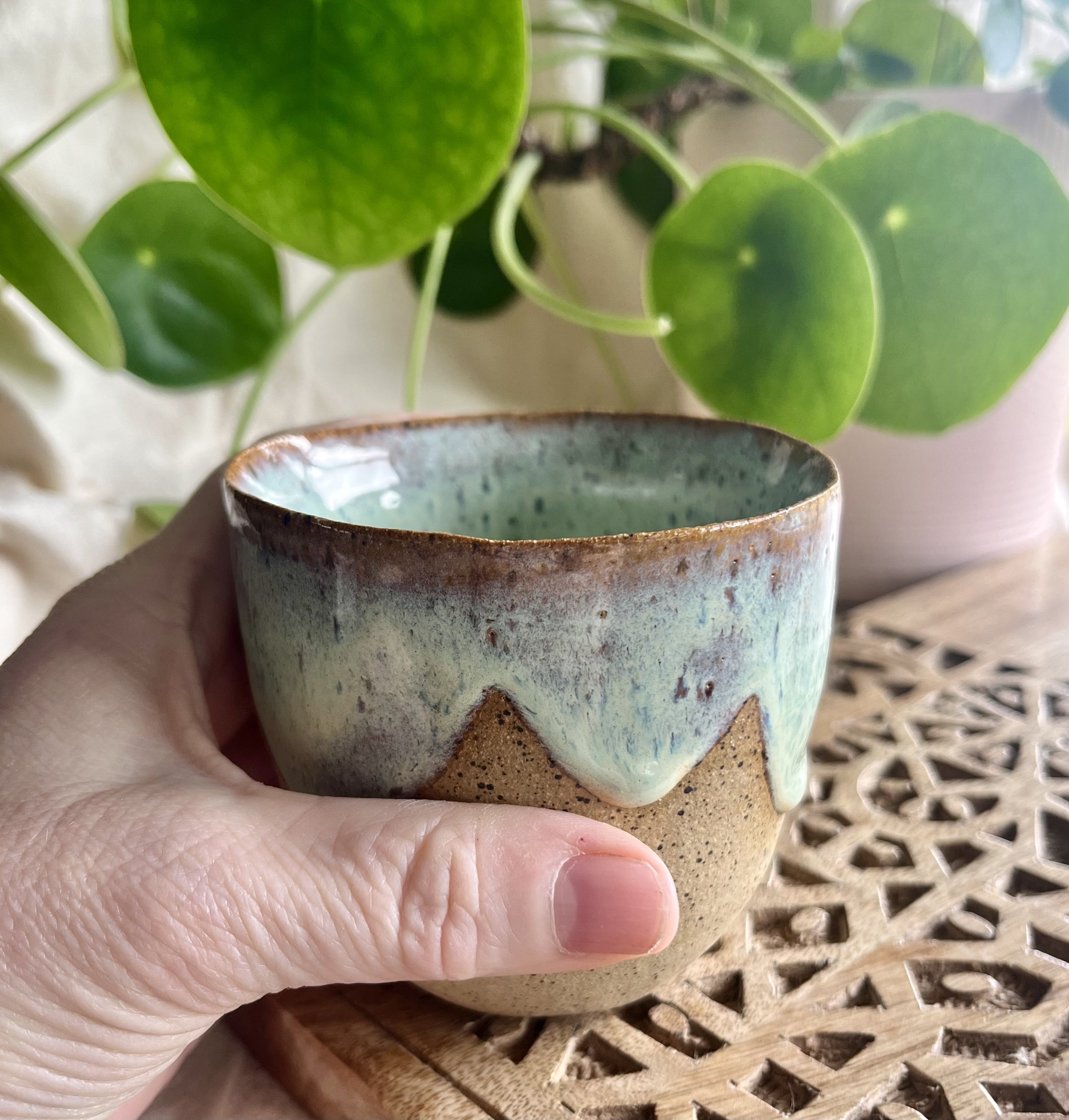 blossom green scalloped cup 1 in hand view.jpeg
