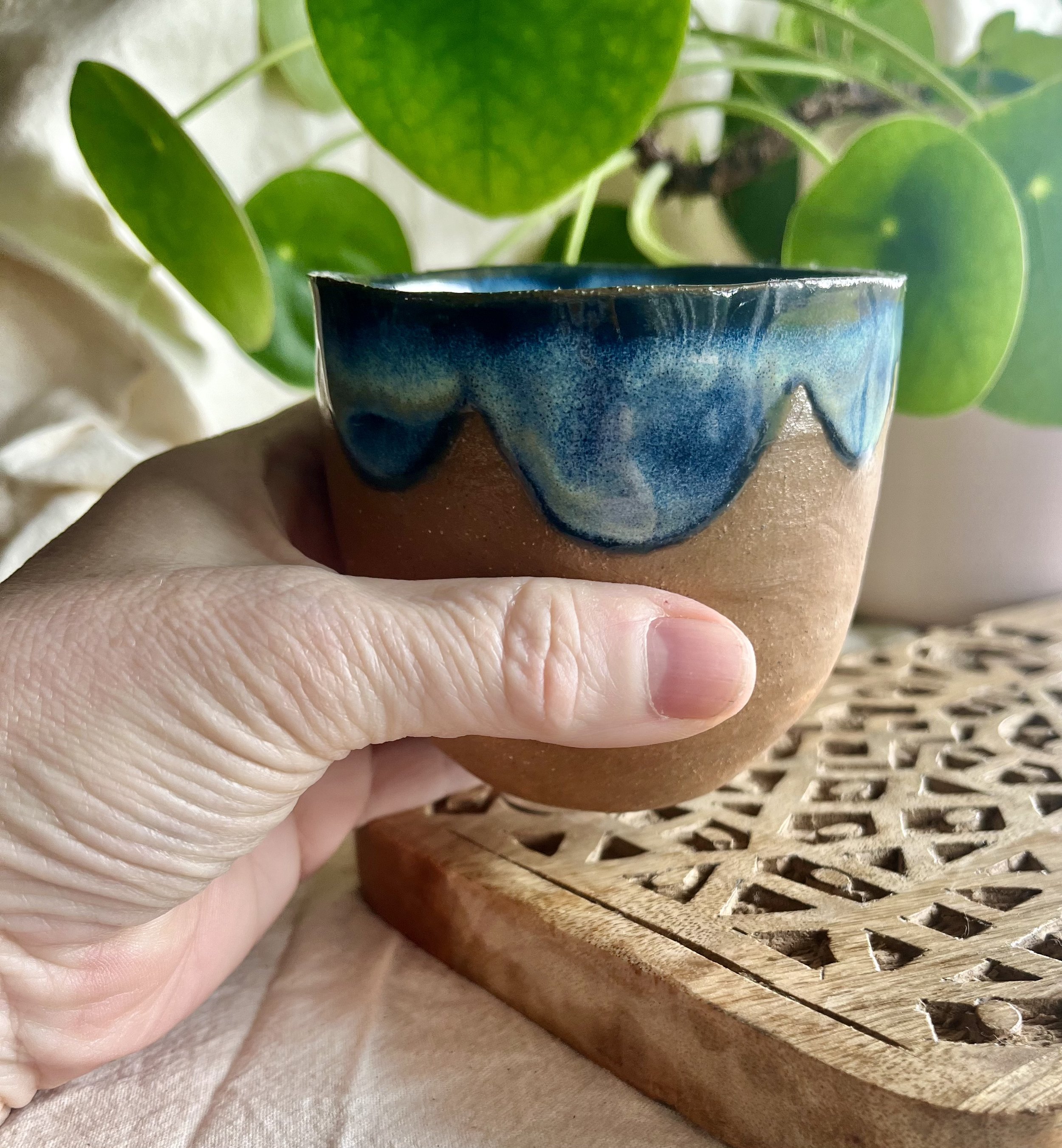 blue midnight scalloped cup in hand view.jpeg
