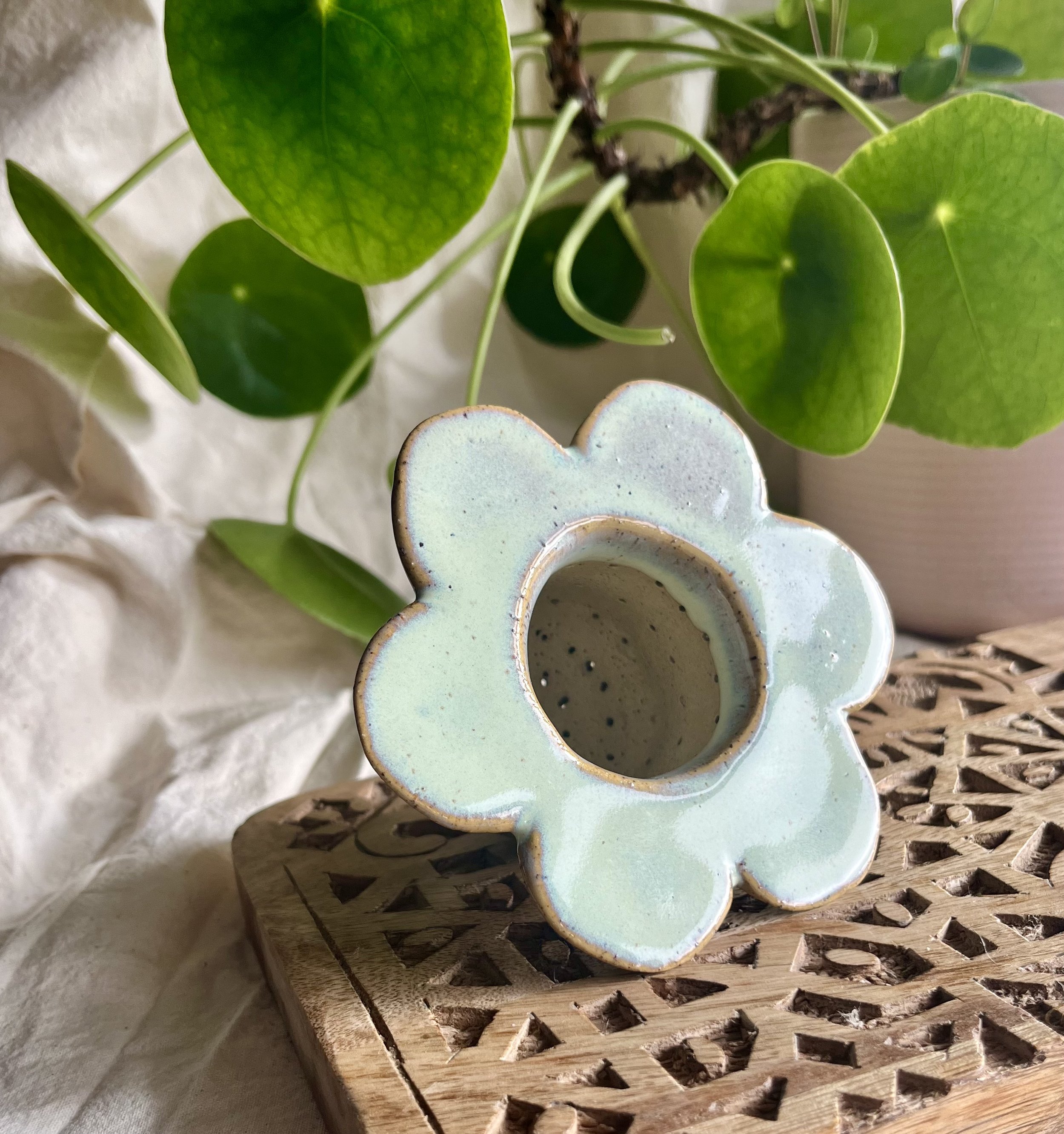 Light green flower tea strainer front view.jpeg